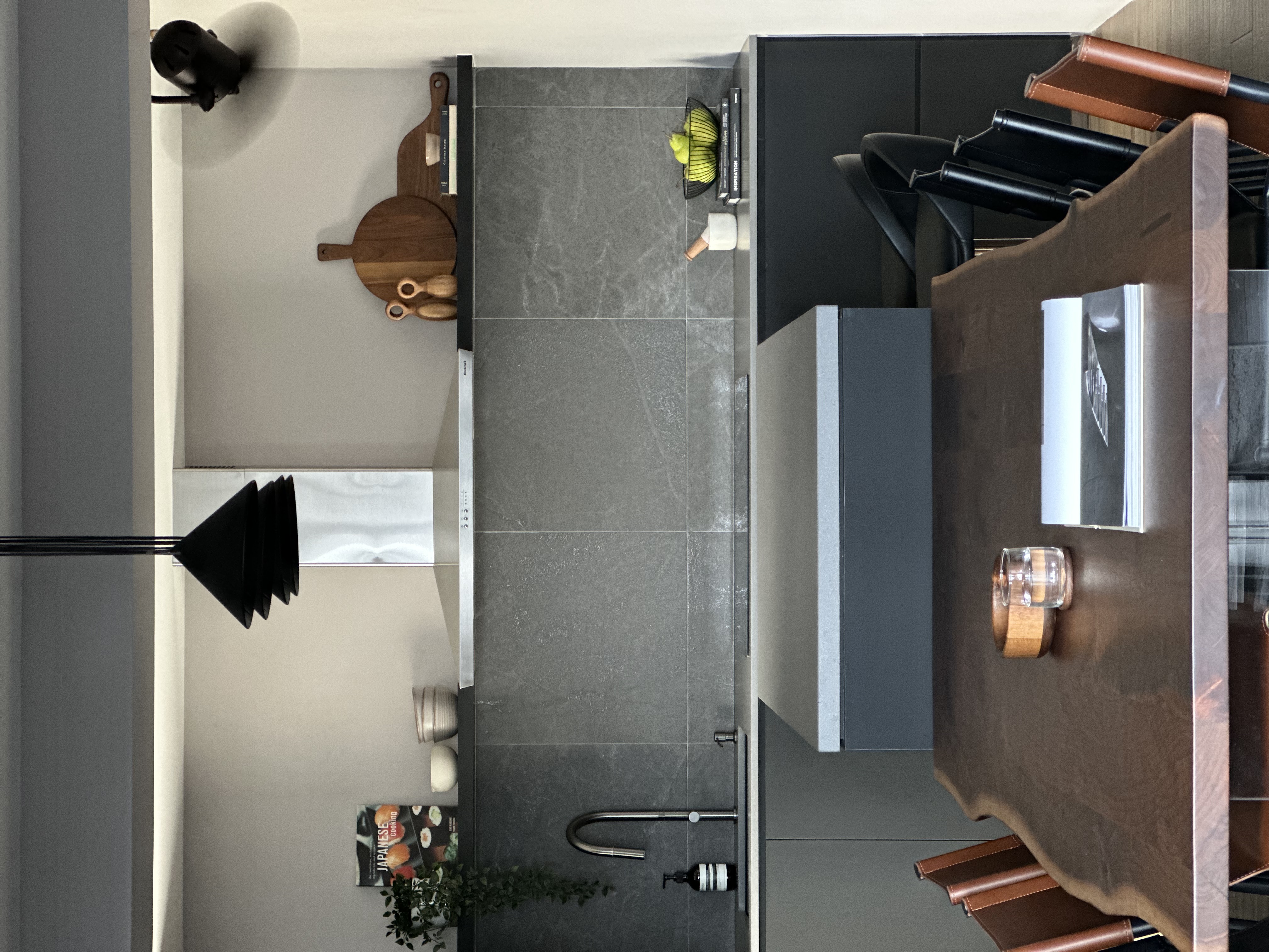 Where conversations, food, games and wine flow - modern kitchen, minimalist design, sleek countertops, dark wood accents