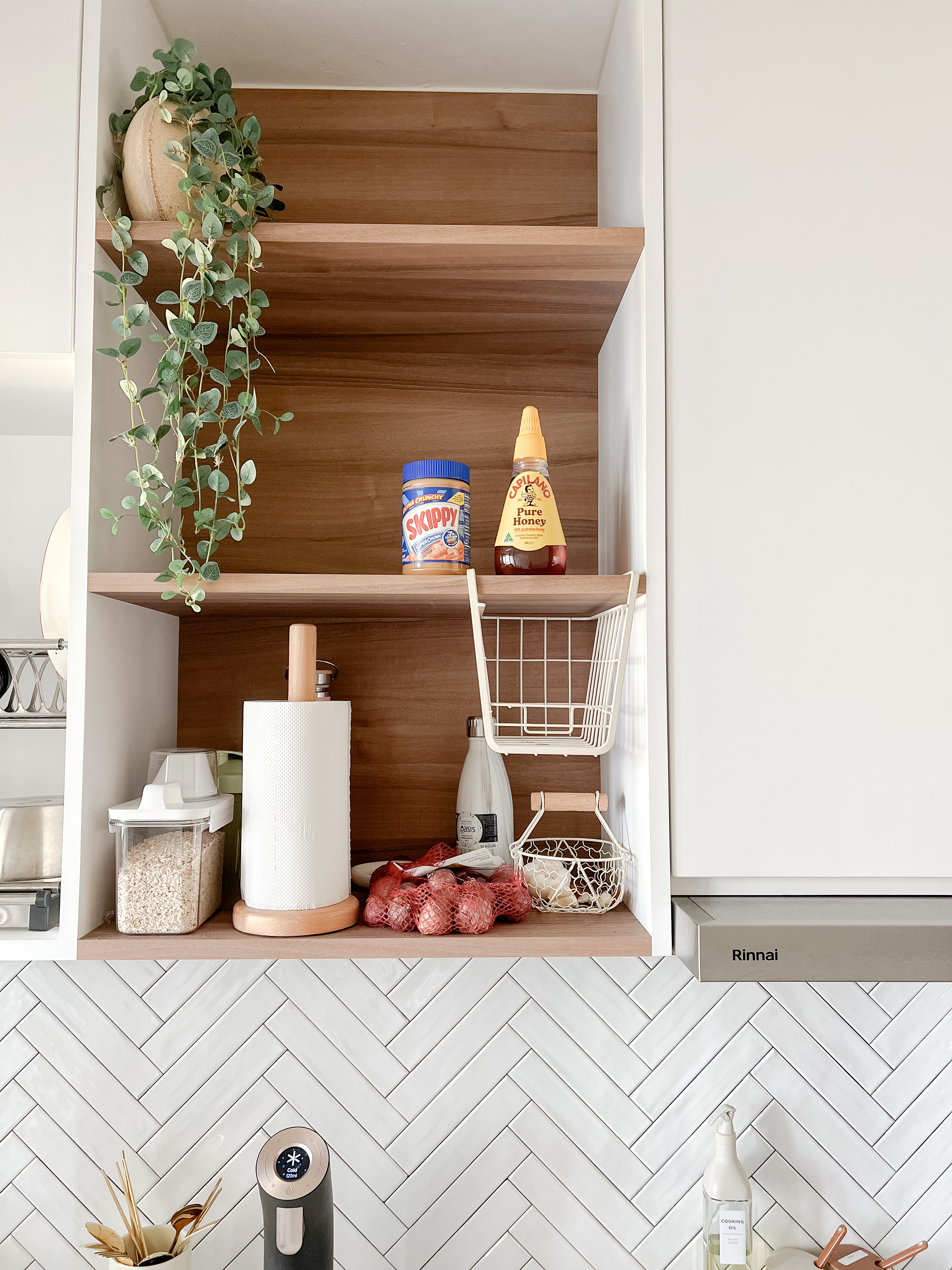 Kitchen - Seasoned with love and laughter  - Wooden shelf, kitchen cabinet, white herringbone tile backsplash, stainless