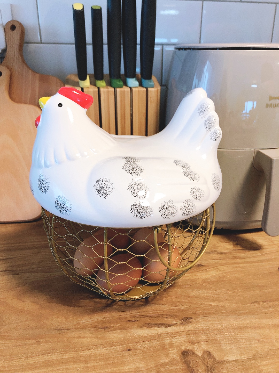 Our small farmhouse kitchen - possibilities of a small kitchen space - White ceramic chicken, egg carton, kitchen counter