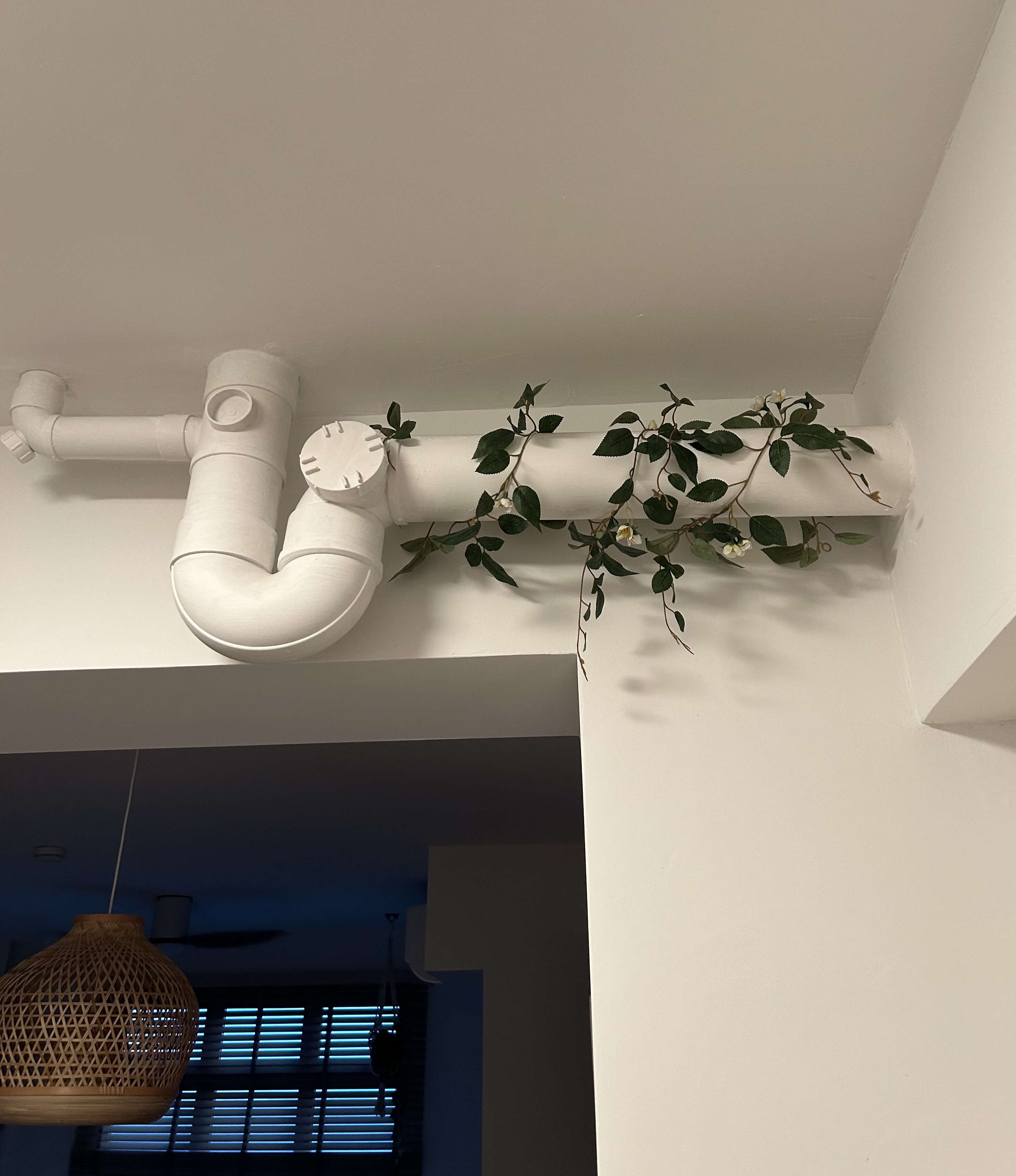 Our small farmhouse kitchen - possibilities of a small kitchen space - white piping, hanging plant, green vines, indoor
