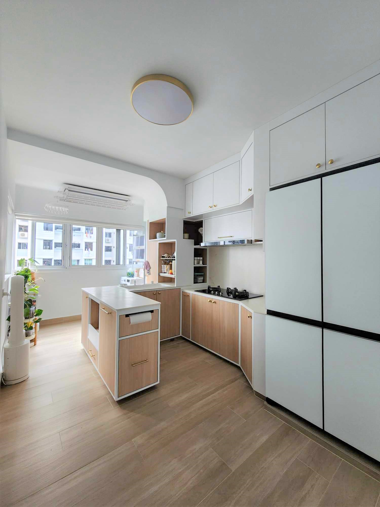 Spacious U-shaped kitchen  - Modern kitchen with white cabinetry and light wood countertops, spacious layout with built-in