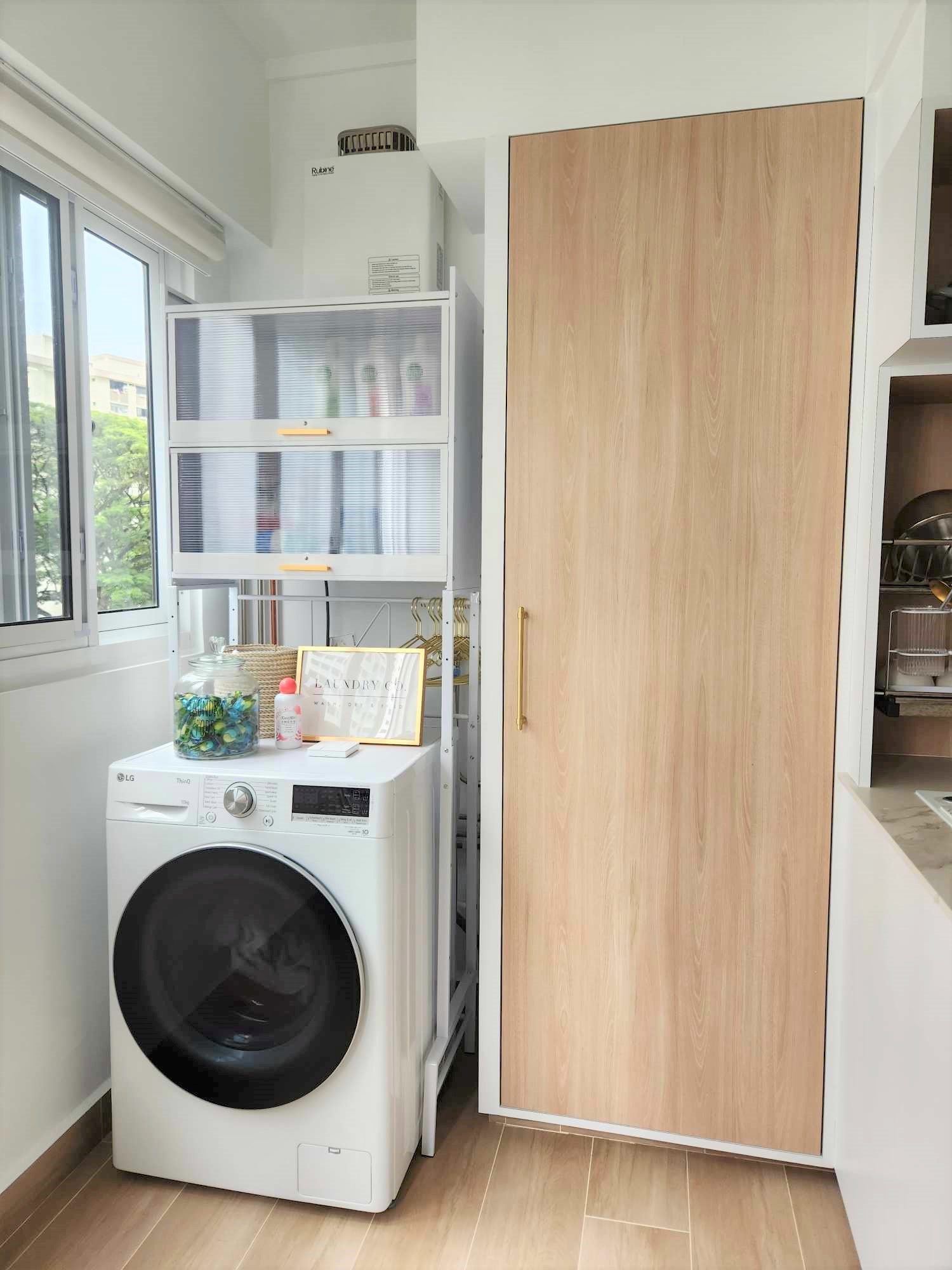 Spacious U-shaped kitchen  - laundry room, white washing machine, wooden cabinet, glass jar, laundry detergent, wooden door