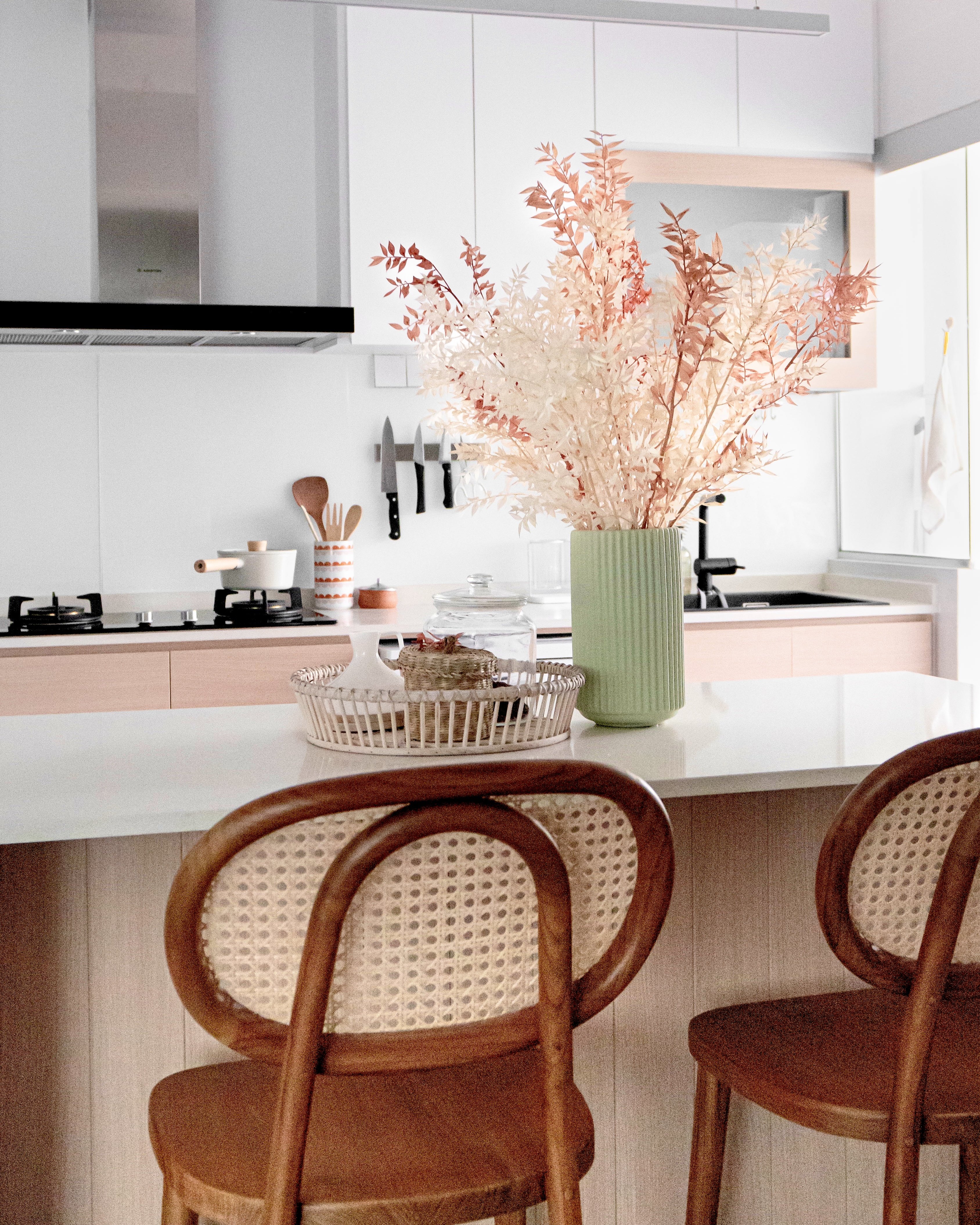 Resort Inspired Living & Dining Space @ GreenFoliage - Modern kitchen with minimalist design, white cabinets, sleek stove