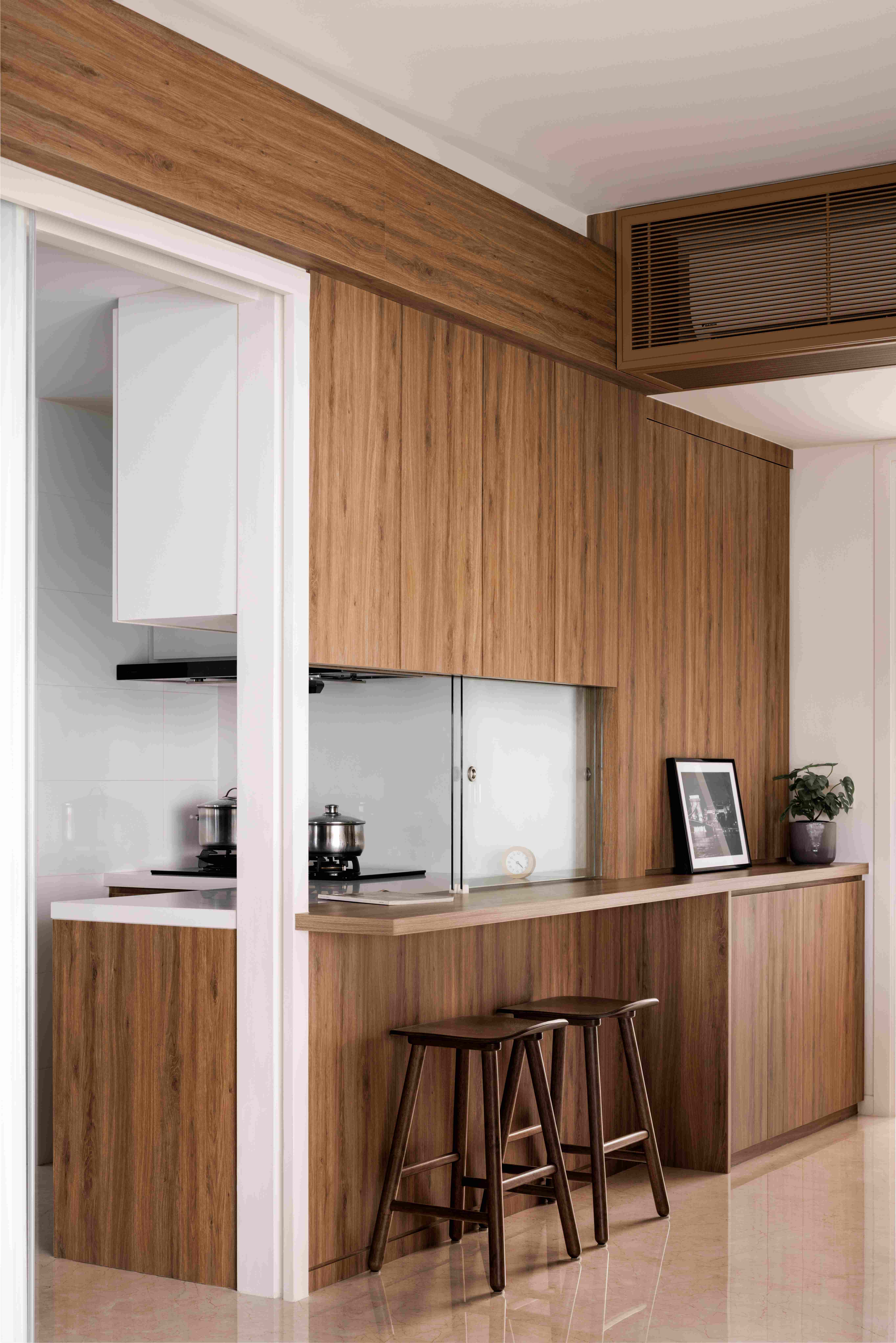 Transforming an old home to emphasise its calmness & warmth - Wooden cabinetry, modern kitchen, white countertops, stainless