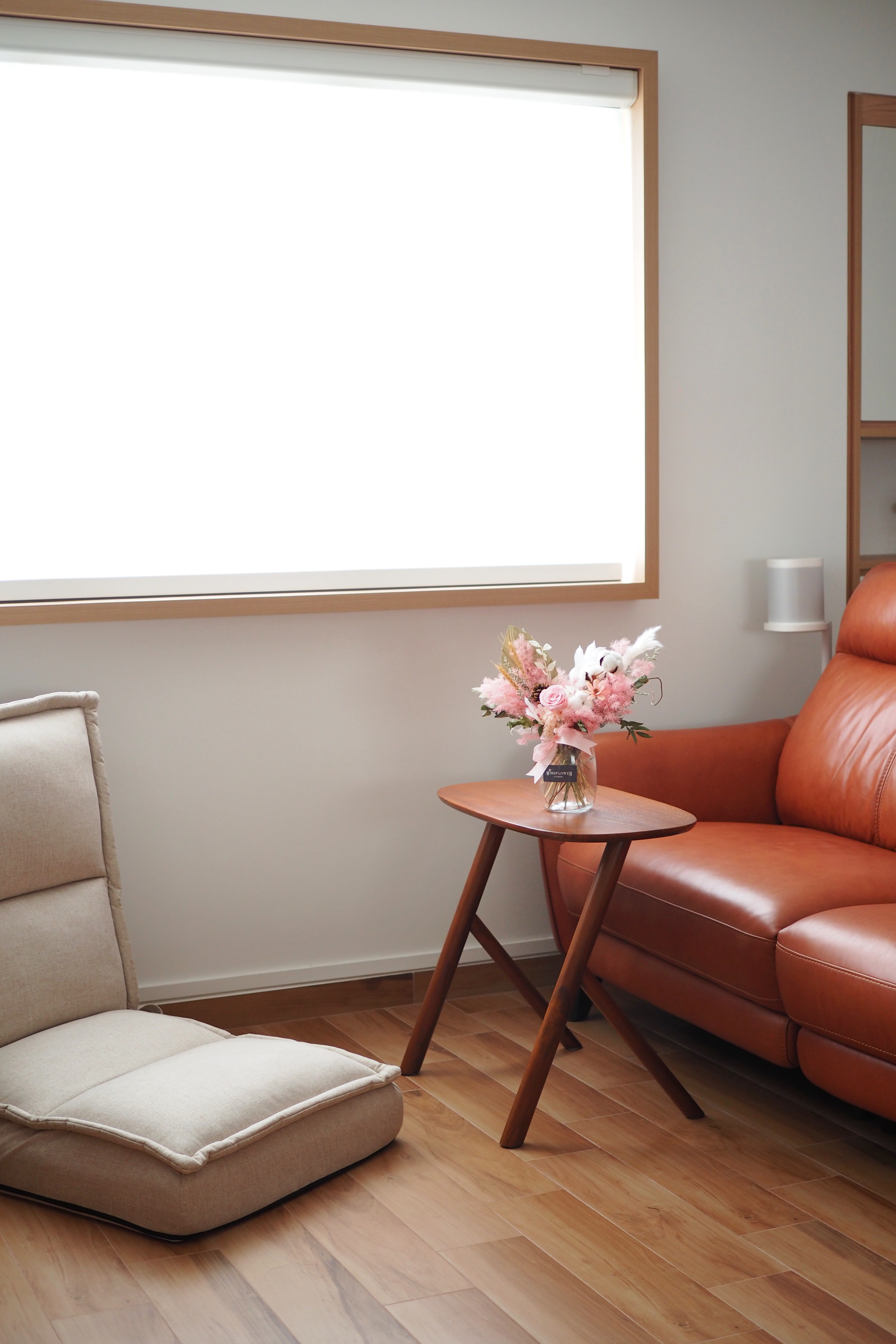 5 tips to make your house BRIGHTER! - Modern living room, cozy seating area, beige armchair, wooden floor, large window, soft