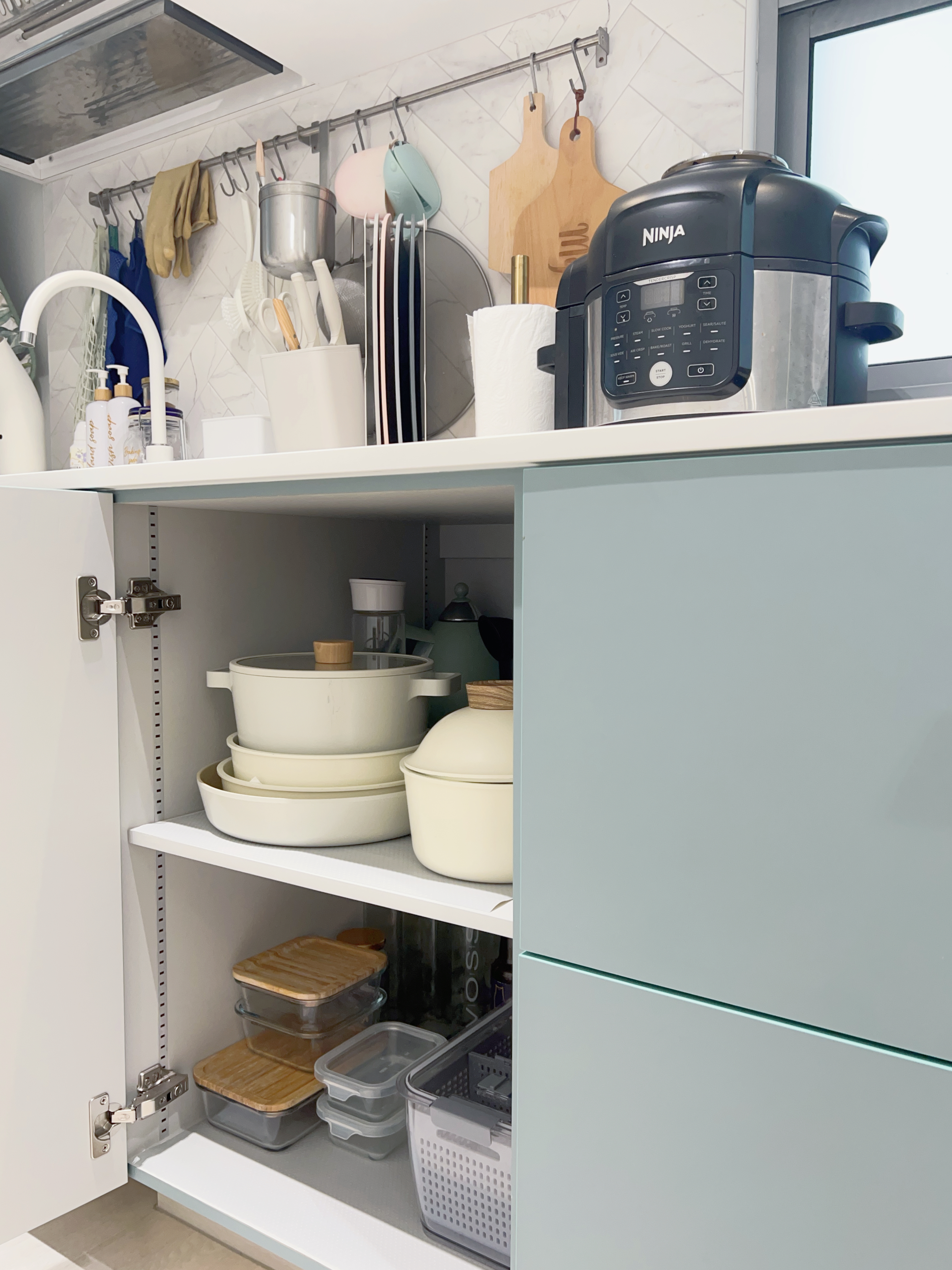 Tips on Organising an Open Concept Kitchen - White kitchen cabinet, open shelf, neatly organized dishes, white bowls, wooden