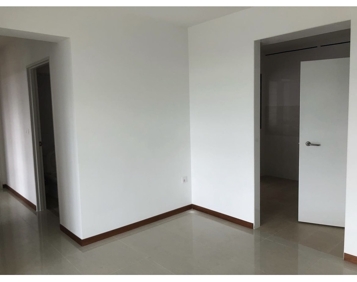 HDB fixtures we stuck with [& those we didn’t ] - Modern minimalist hallway, clean white walls, polished tile floor, recessed