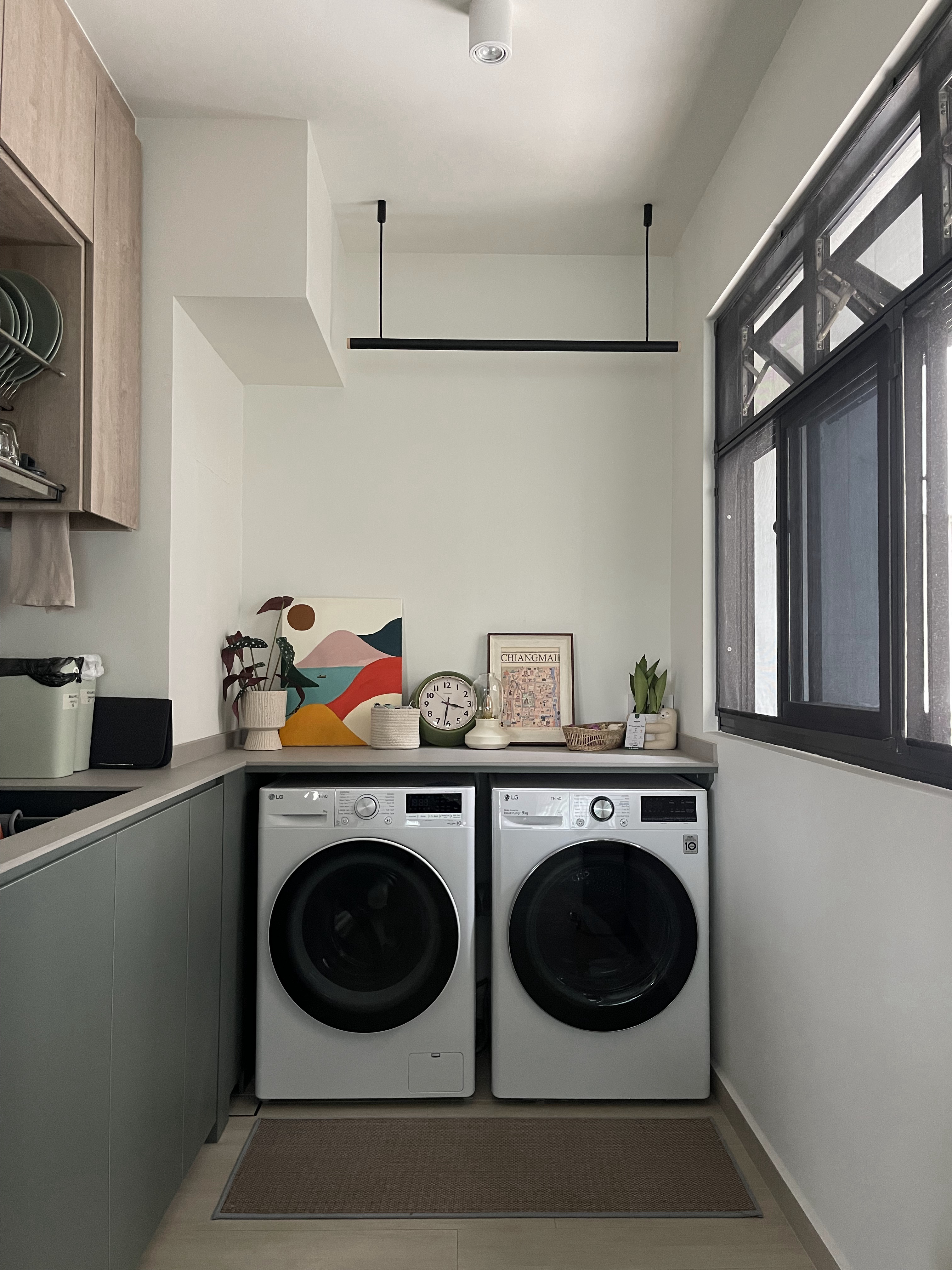 Styling with Faux Plants (& 1 Real Plant) - Modern laundry room, dual washing machines, sleek design, minimalist decor, gray