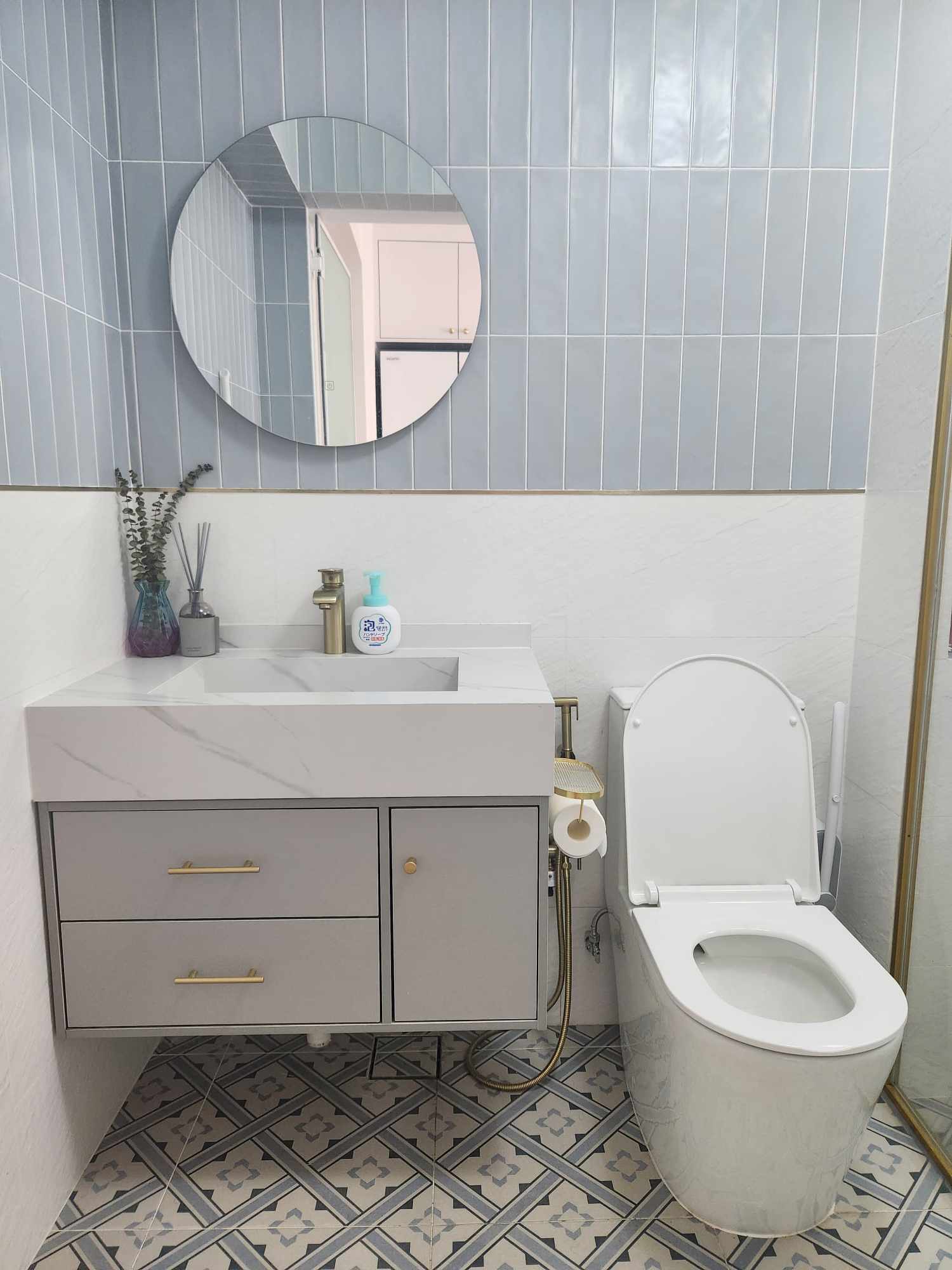 Hotel Vibes Bathroom 😍 - White marble vanity, gray cabinets, gold handles, round mirror, white sink, bathroom fixtures
