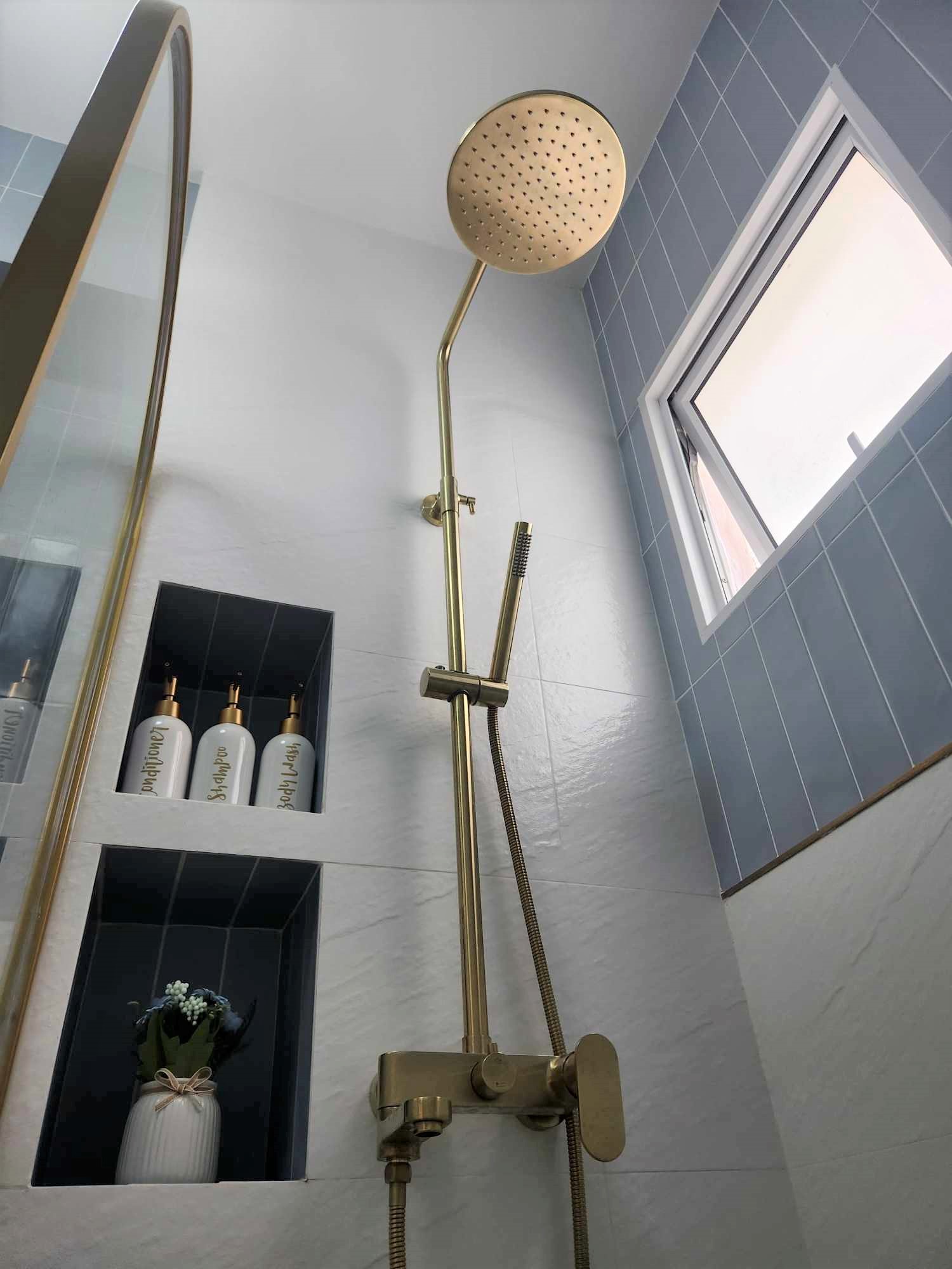 Hotel Vibes Bathroom 😍 - Golden shower head, modern shower fixture, sleek design, elegant bathroom, contemporary shower