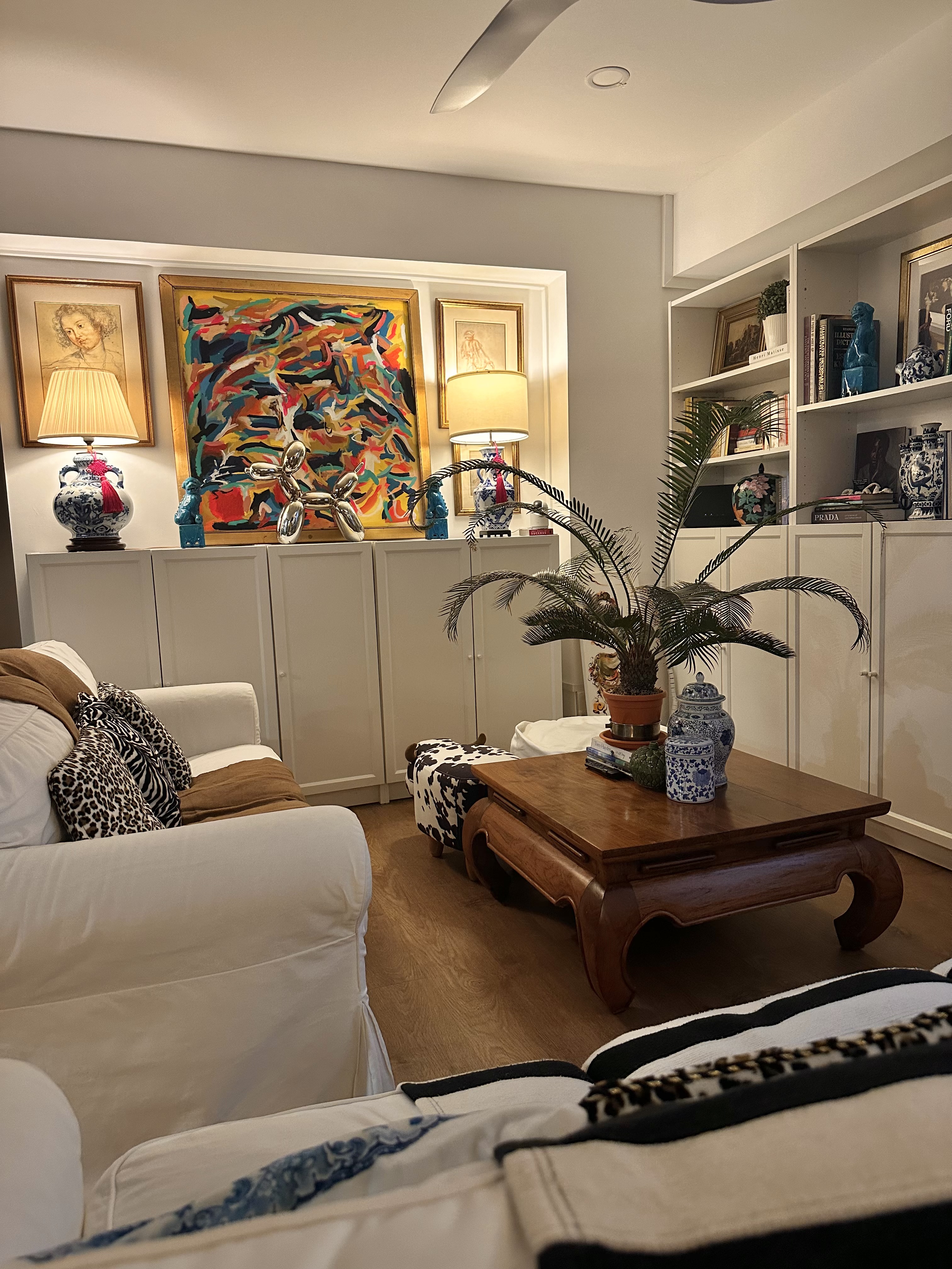 The Magic of Our Home from Day to Night - modern living room, cozy seating, white couch, leopard print pillows, abstract