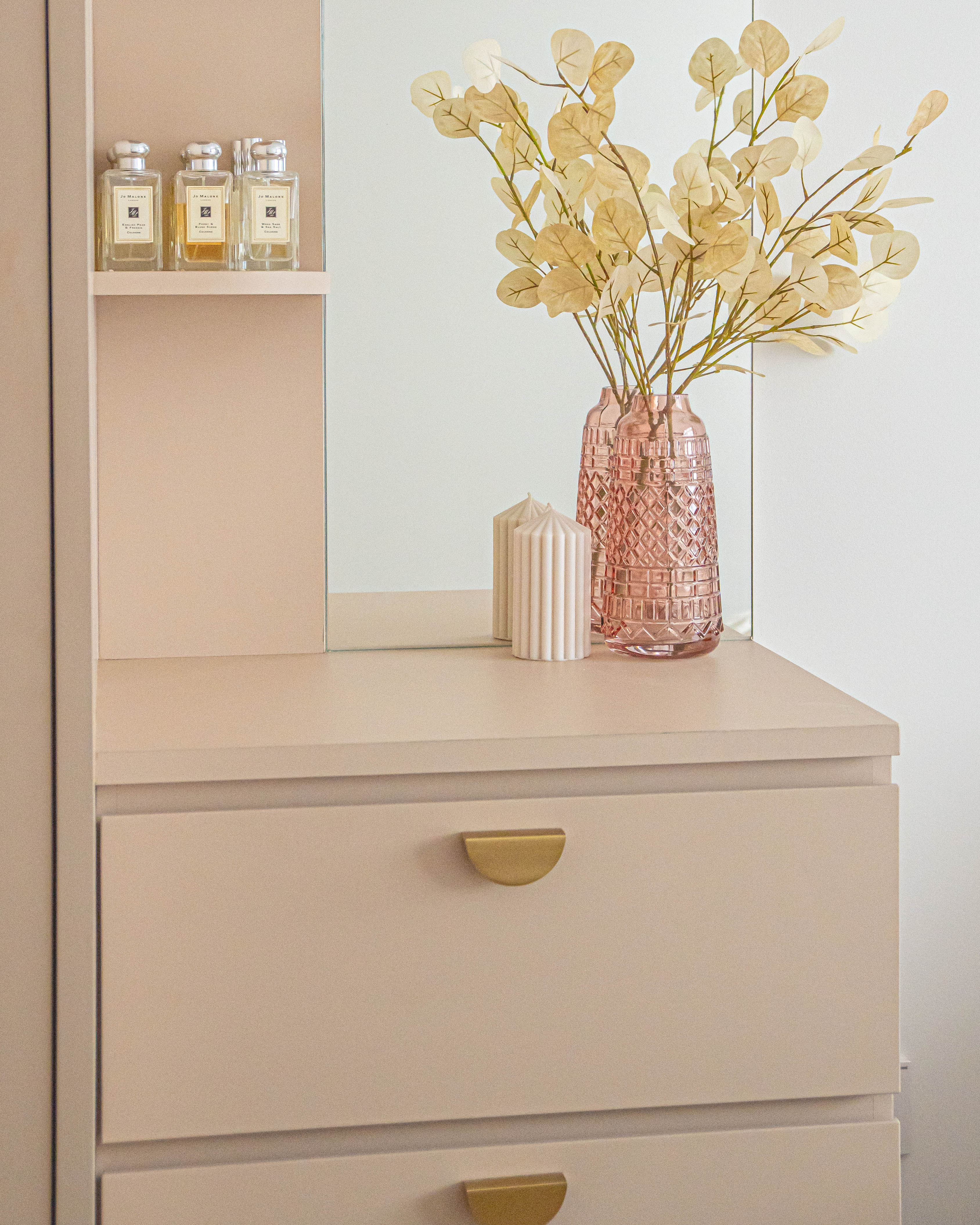 Tips to Create A Feminine Boho Bedroom - vintage, minimalist, pastel, beige, wooden, drawer, gold handles, candle, vase