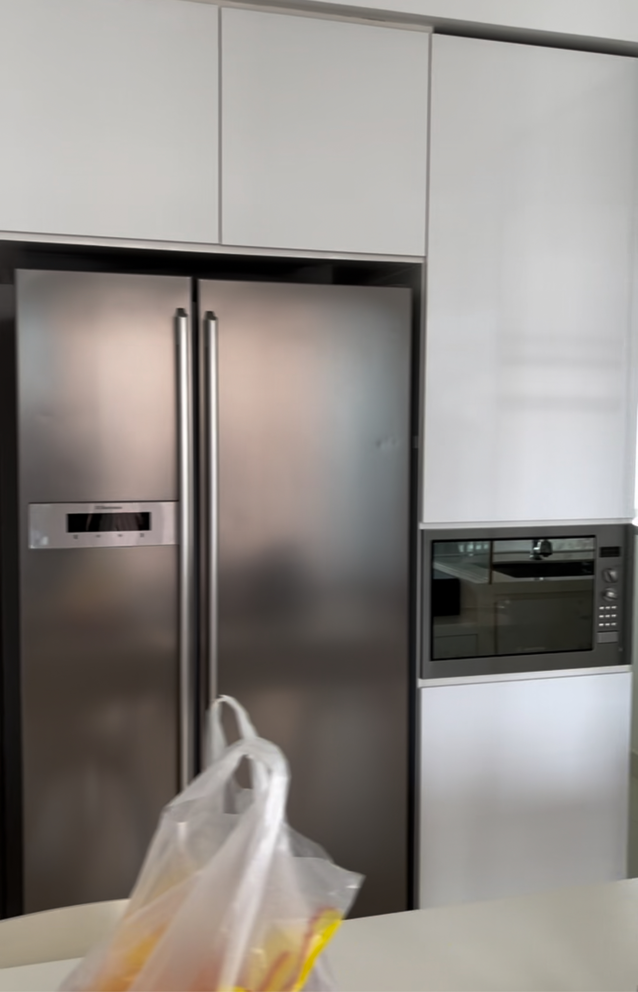 Our Kitchen: Before & After  - Modern kitchen, stainless steel refrigerator, white cabinets, sleek design, contemporary