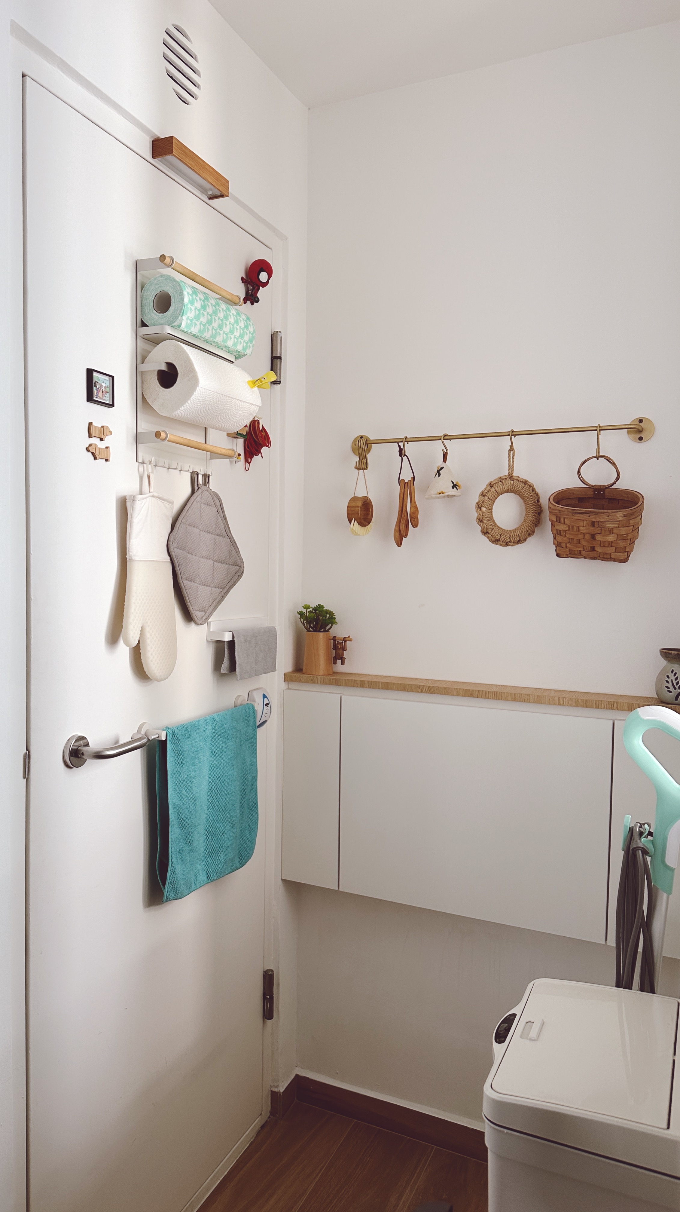Our Kitchen: Before & After  - roll-off toilet paper, towel rack, wooden hangers, laundry basket, cleaning tools, scrub
