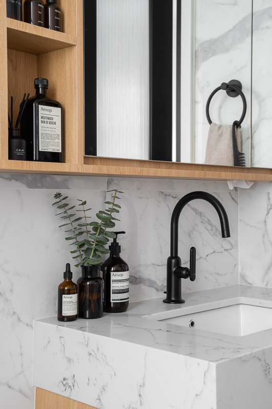 Our Simple & Function Bathrooms: Before & After  - Mint green plants, black faucet, white marble countertop, wooden shelf