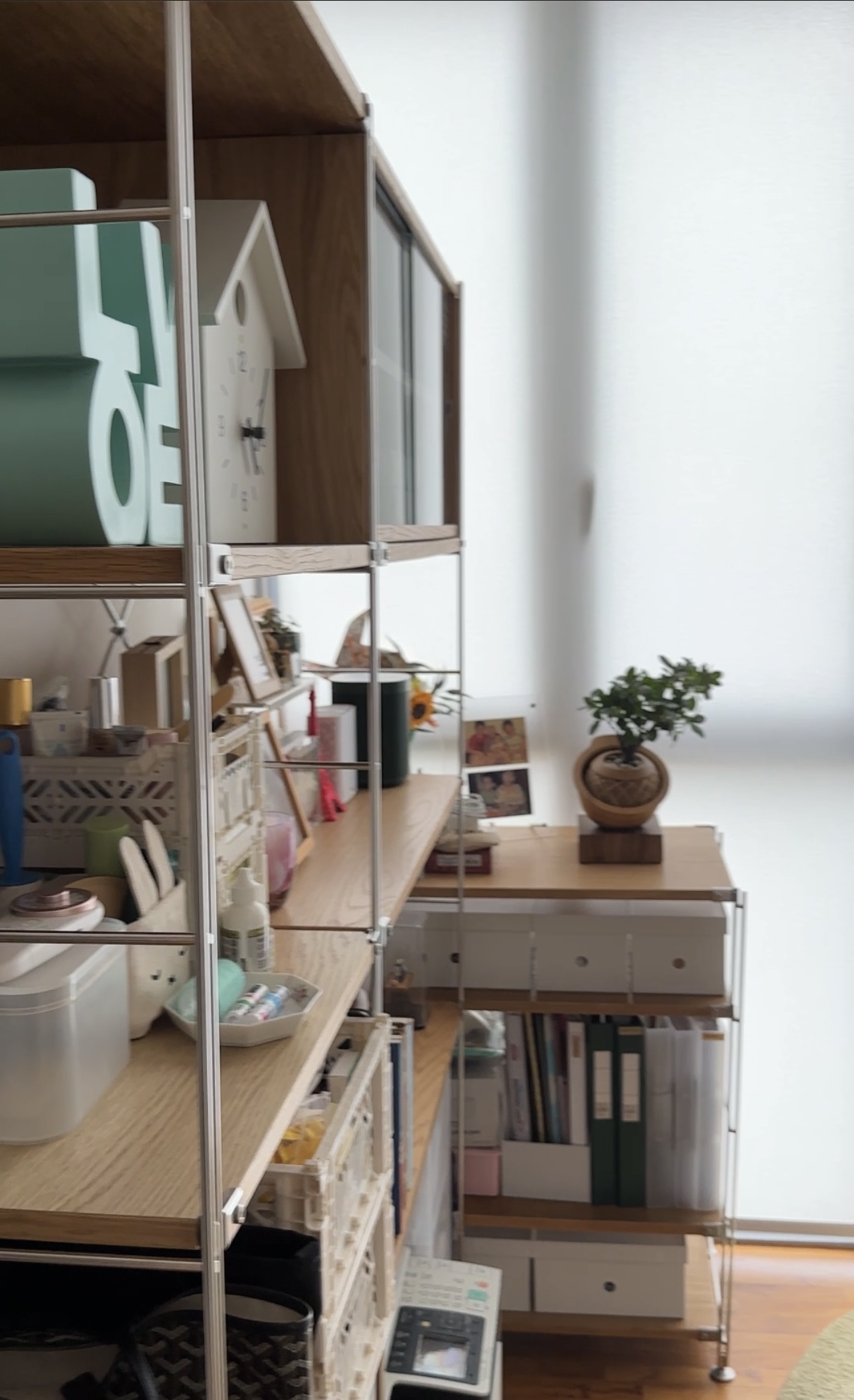 My cosy and simple WFH office  - Organized workspace, minimalist decor, wooden shelving, white clock, potted plant, natural