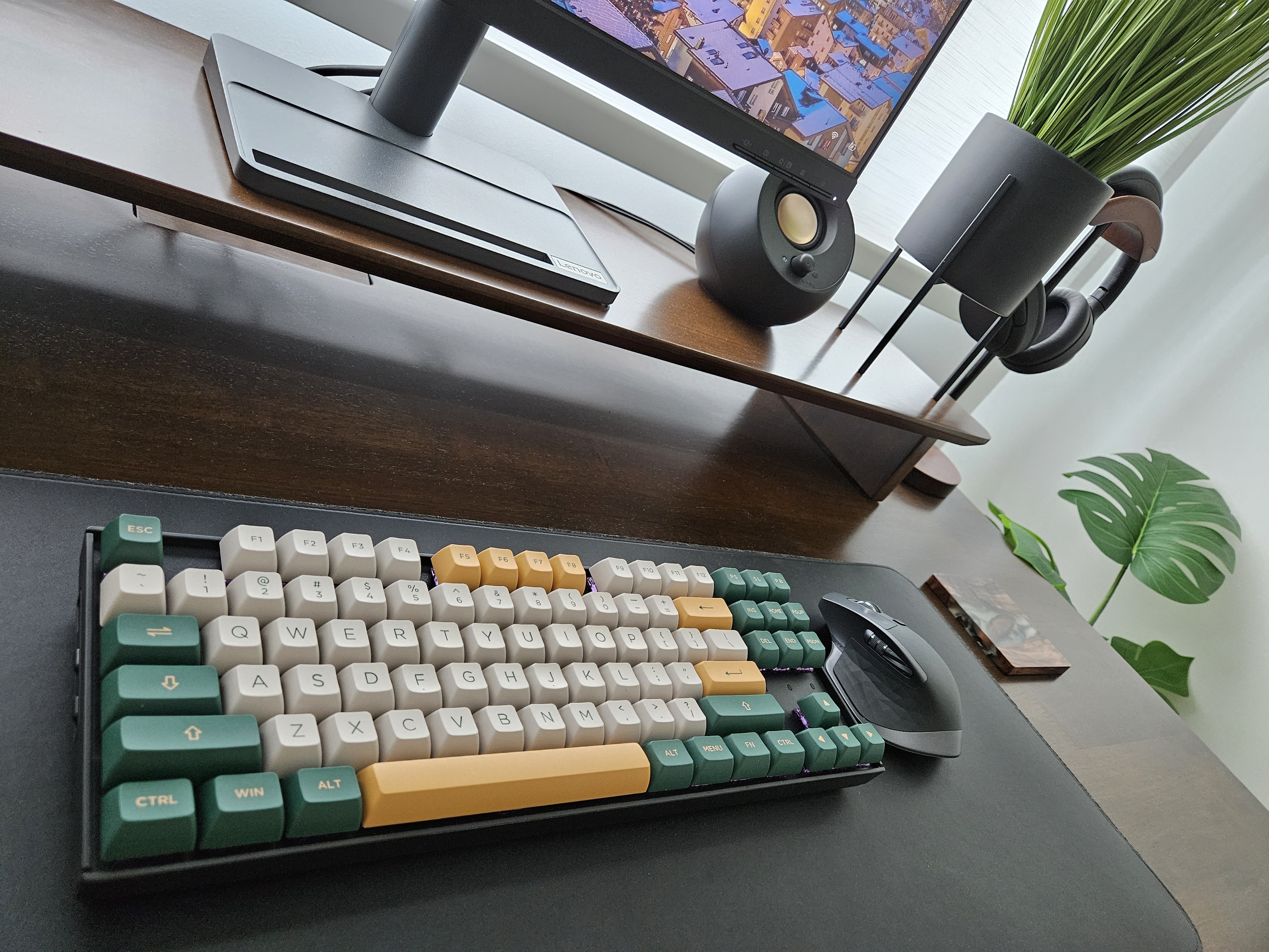 Simple & Clutter-Free Workspace - Modern ergonomic keyboard with customizable keycaps, sleek black and green color scheme