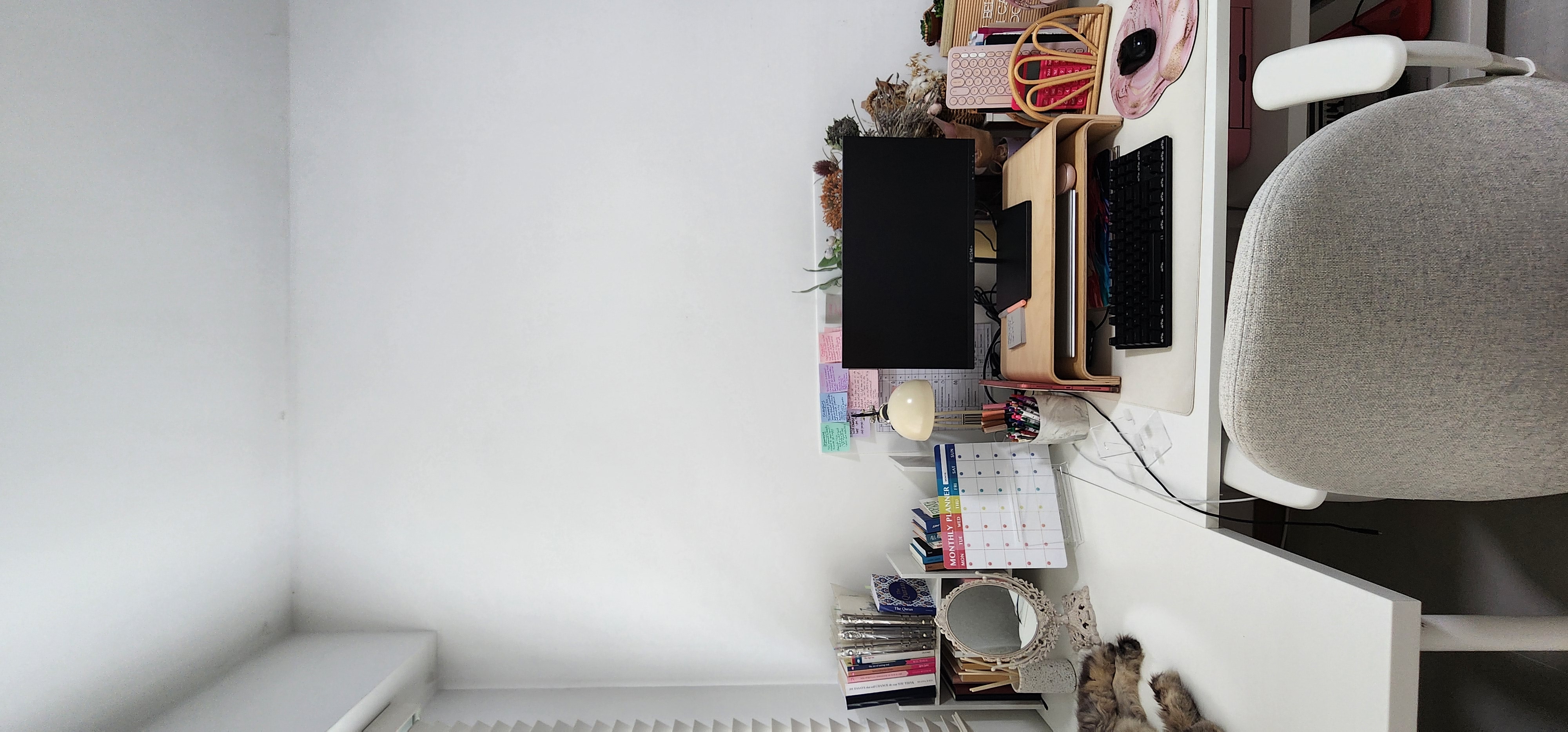 The Qurated Office - White desk, minimalist workspace, organized desk, black monitor, wooden desk drawer, colorful planner