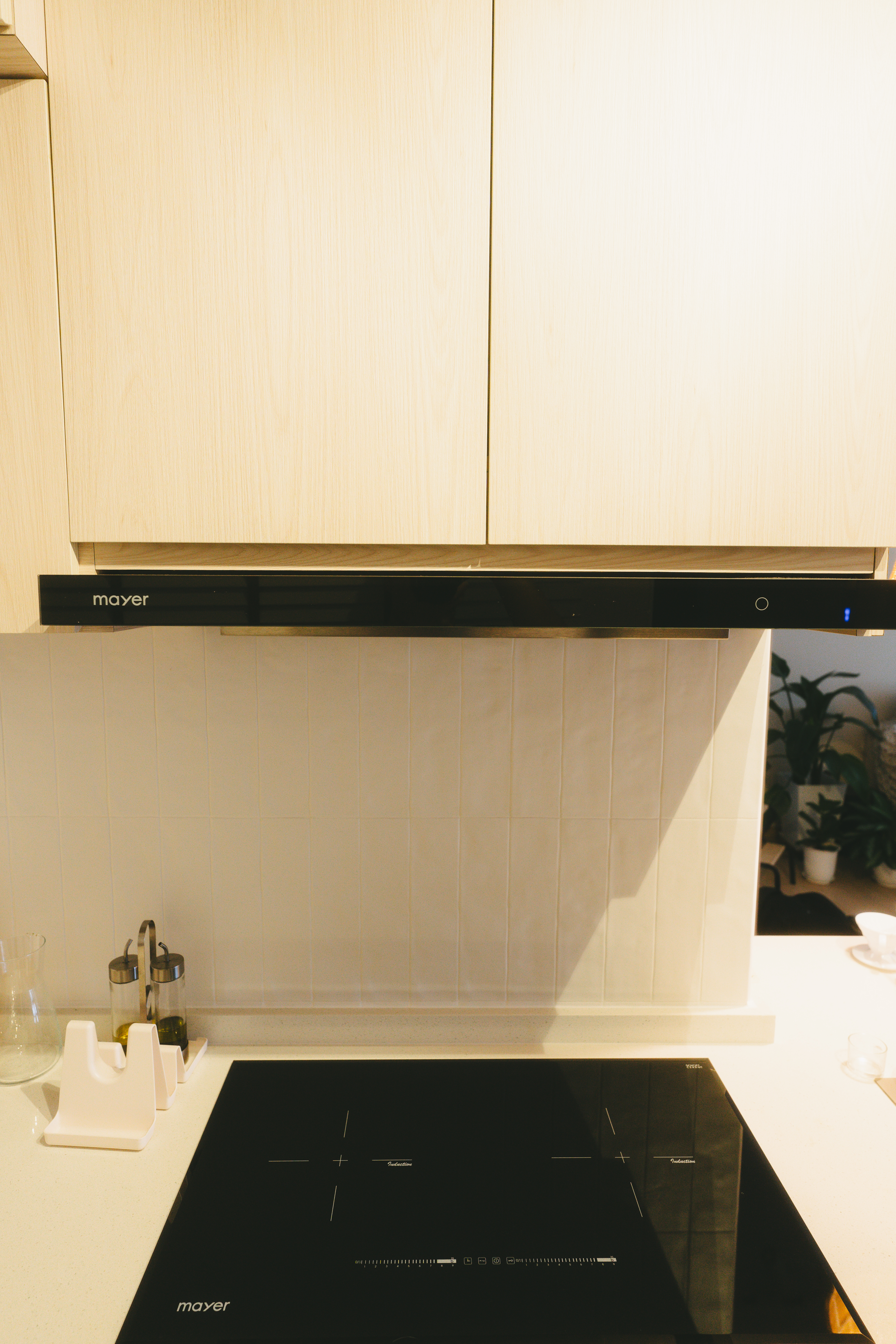 A rather uninspiring kitchen | Thoughts and reflections - Wooden kitchen cabinets, black stove top, modern kitchen design