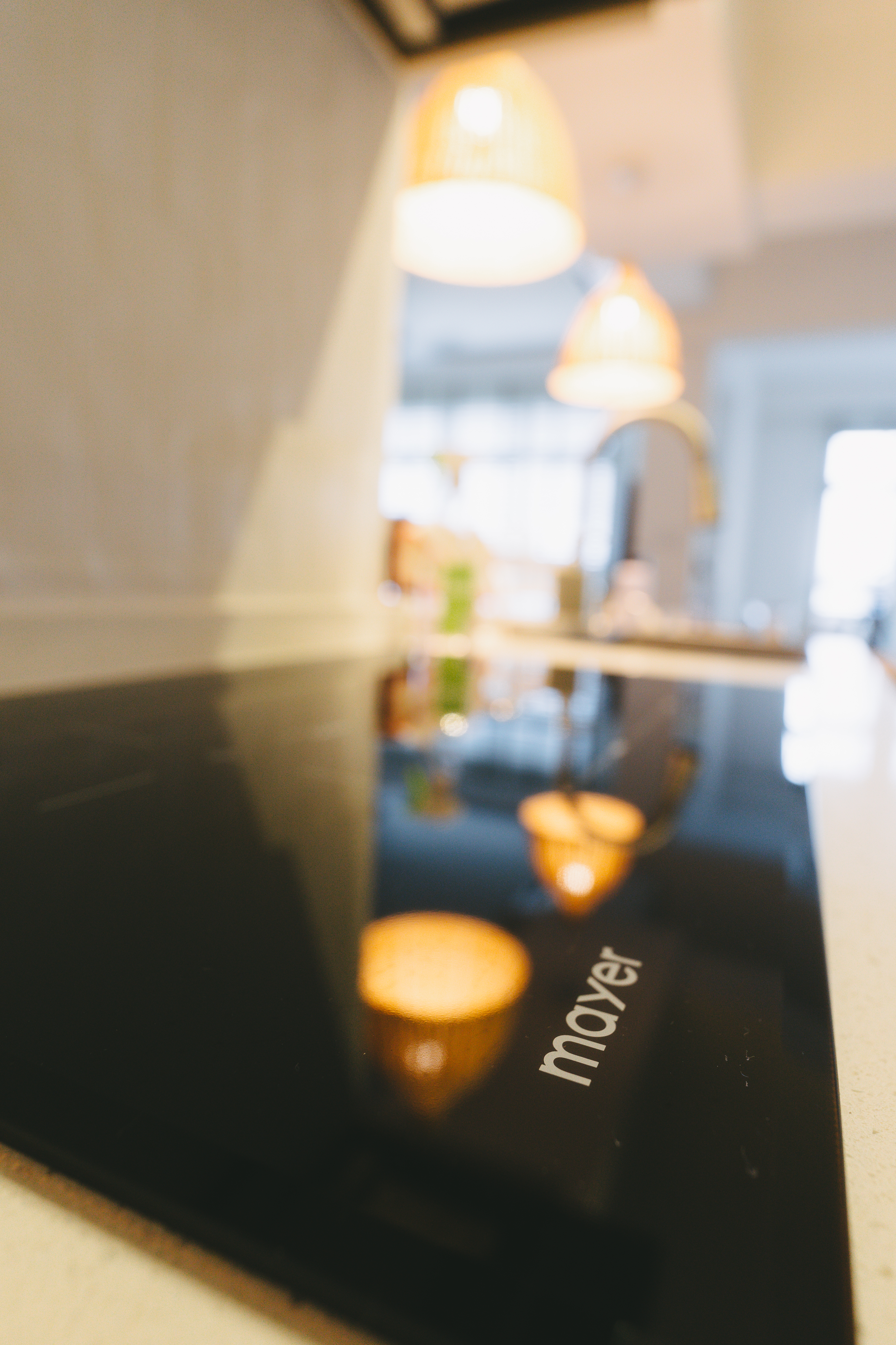 A rather uninspiring kitchen | Thoughts and reflections - black induction cooktop, modern kitchen, sleek design, glossy