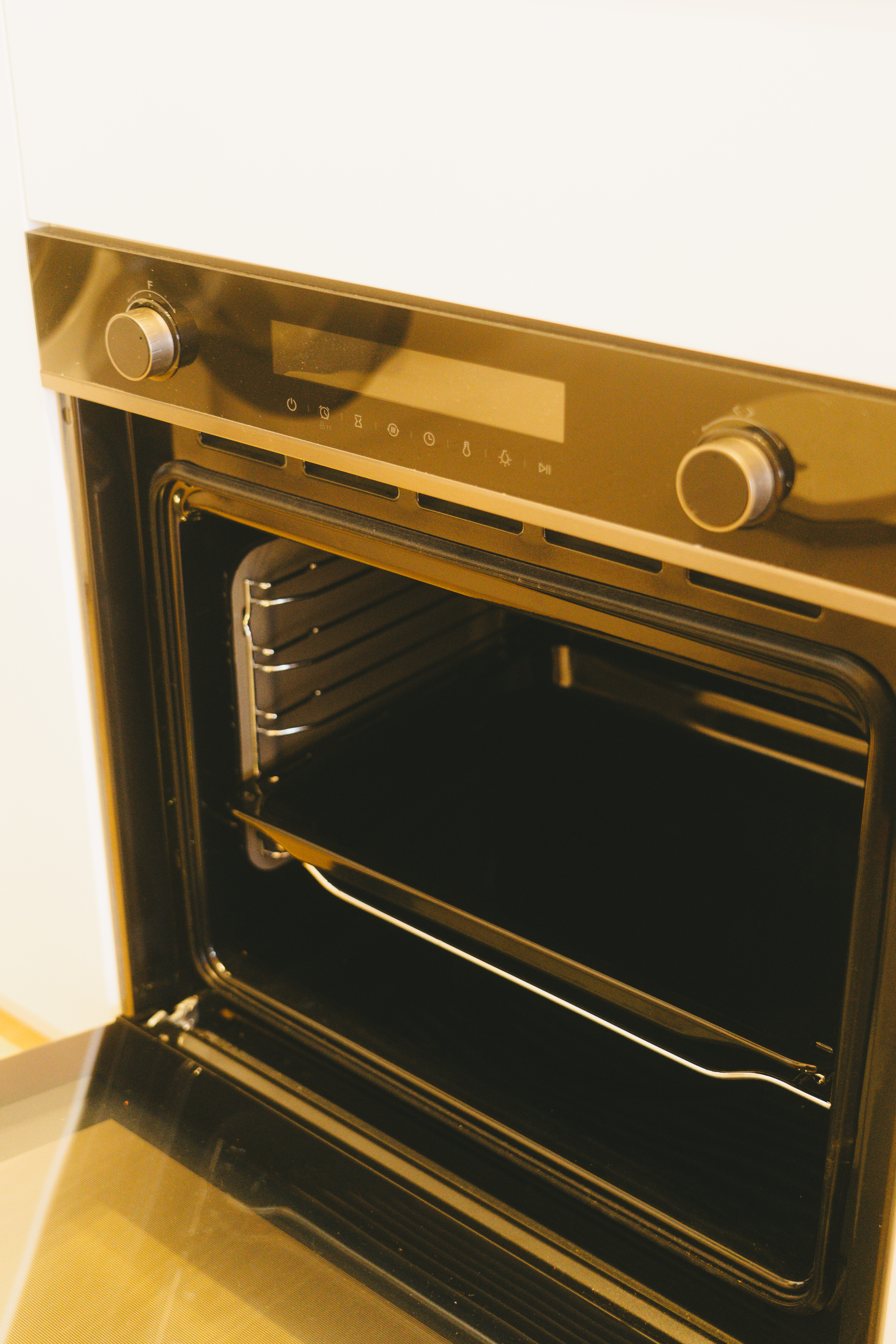 A rather uninspiring kitchen | Thoughts and reflections - Modern oven with digital controls, control knobs, and digital