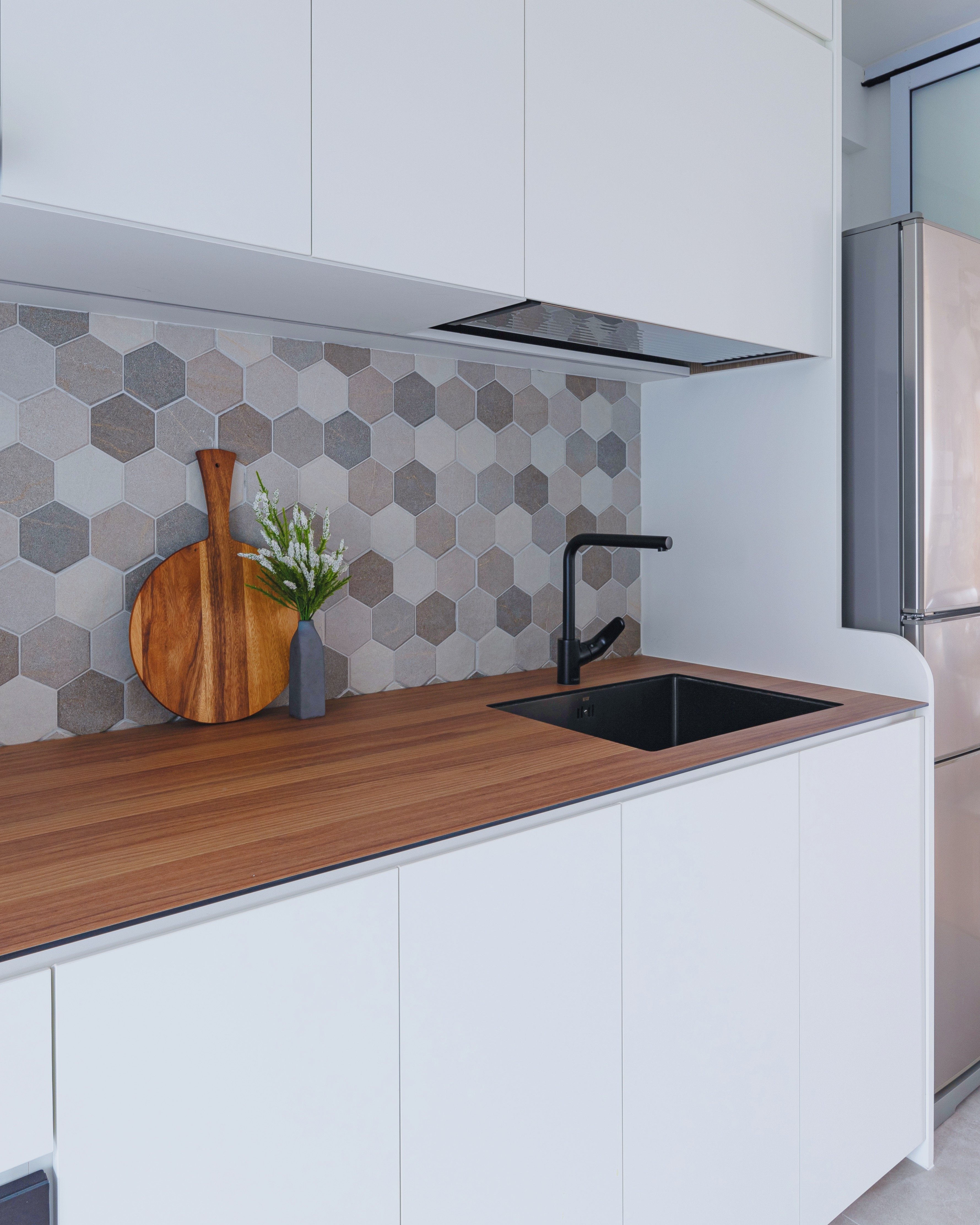 How to Create A Nordic Heaven! - Hexagonal tile backsplash, modern kitchen design, white cabinets, wooden countertop, black