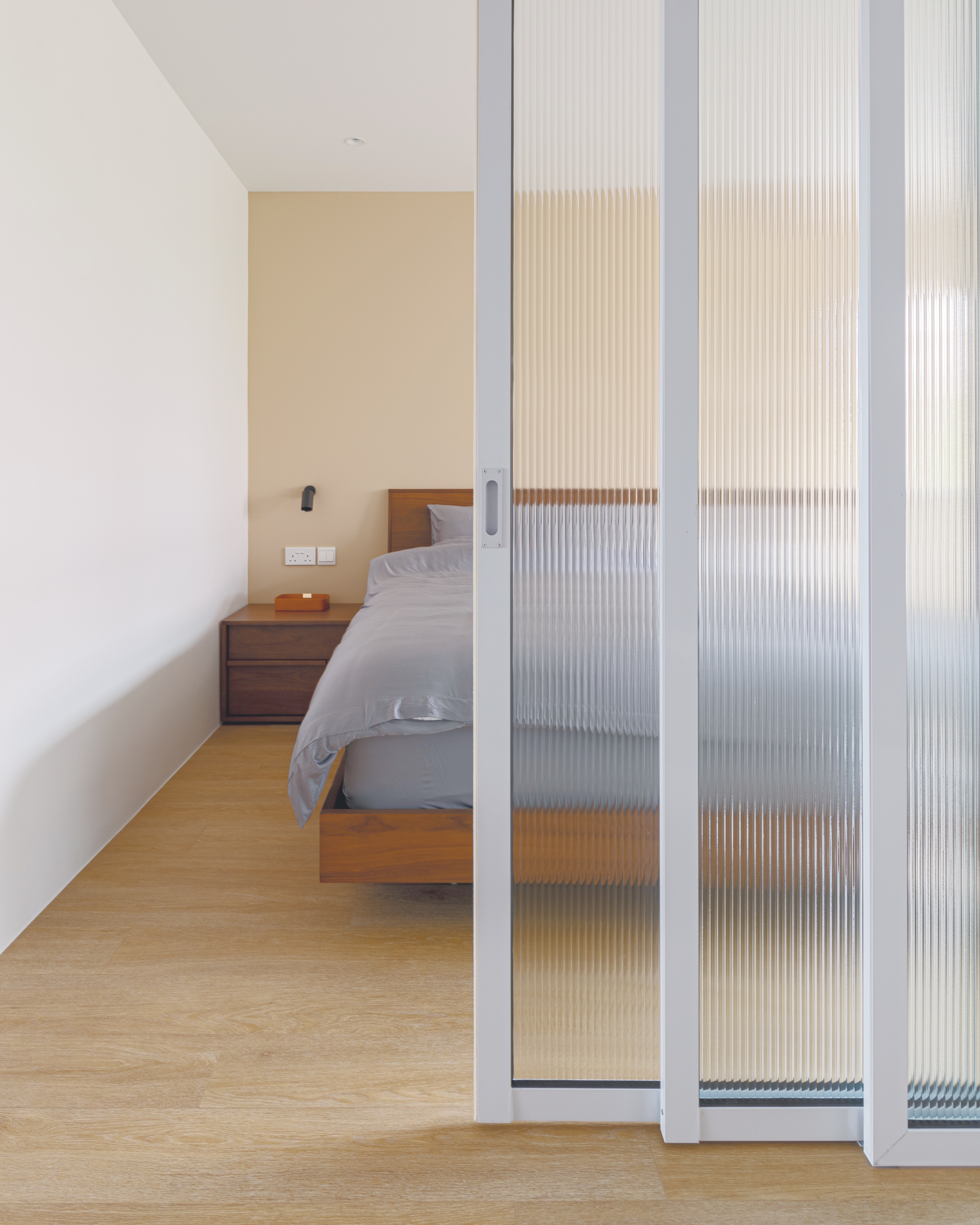 How to Create A Nordic Heaven! - Modern minimalist bedroom, light beige walls, wooden floor, wooden nightstand, gray