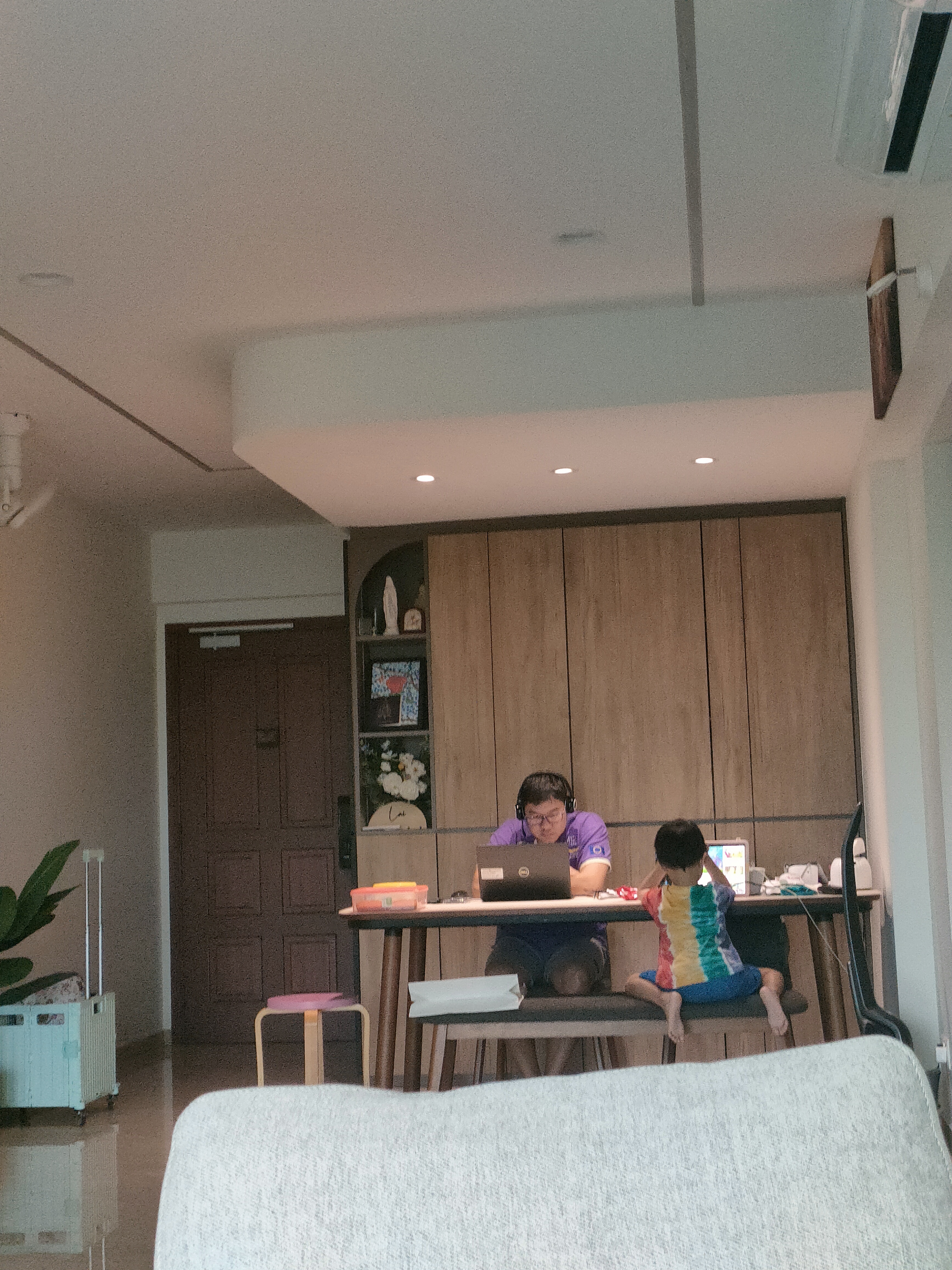 study, study, study! a study room for kids - Person working on laptop in living room, Child sitting on chair in front of