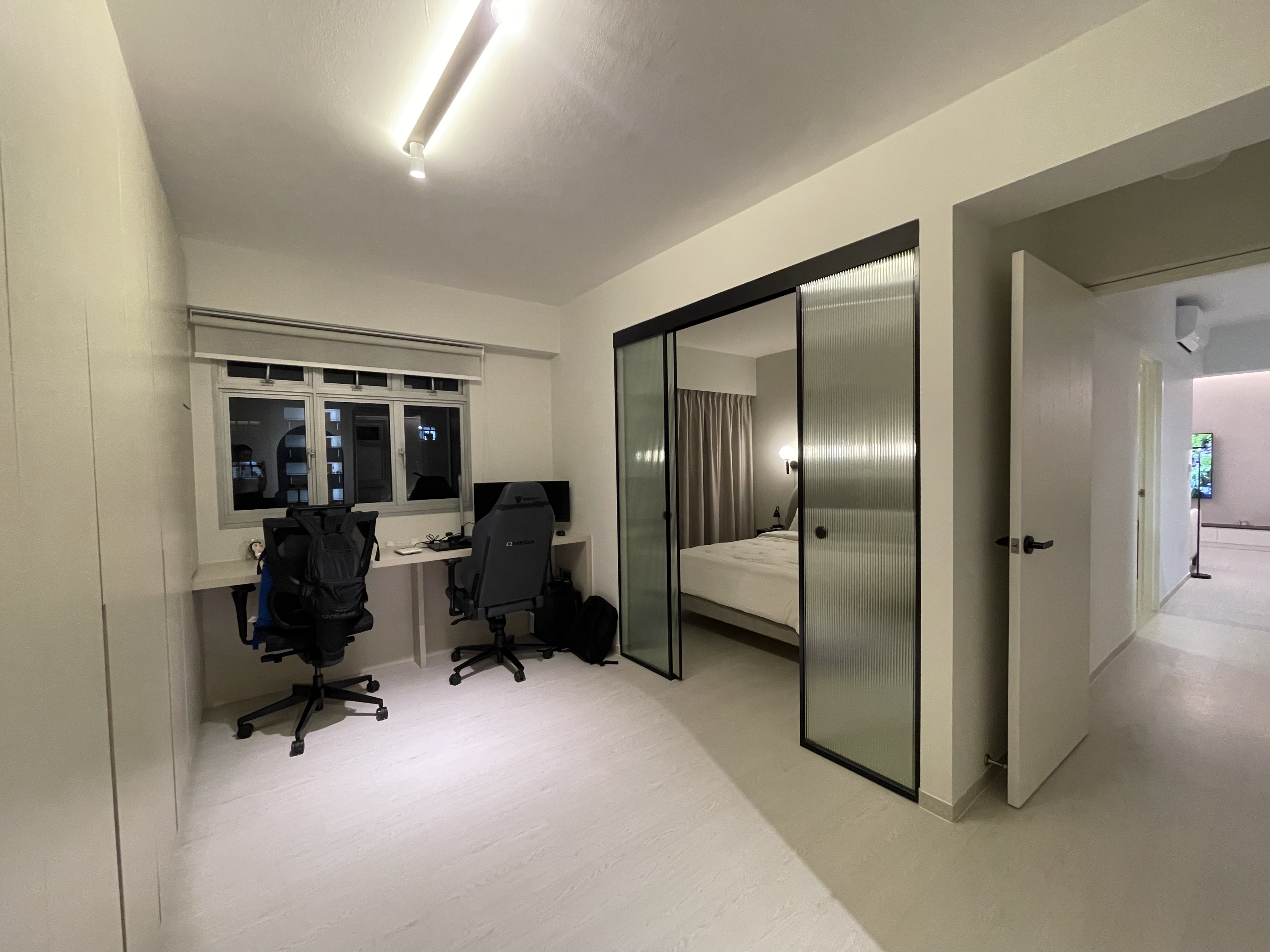 Walk-in wardrobe? Study? Getting ready without disturbing one another - Modern minimalist bedroom, sleek desk, ergonomic