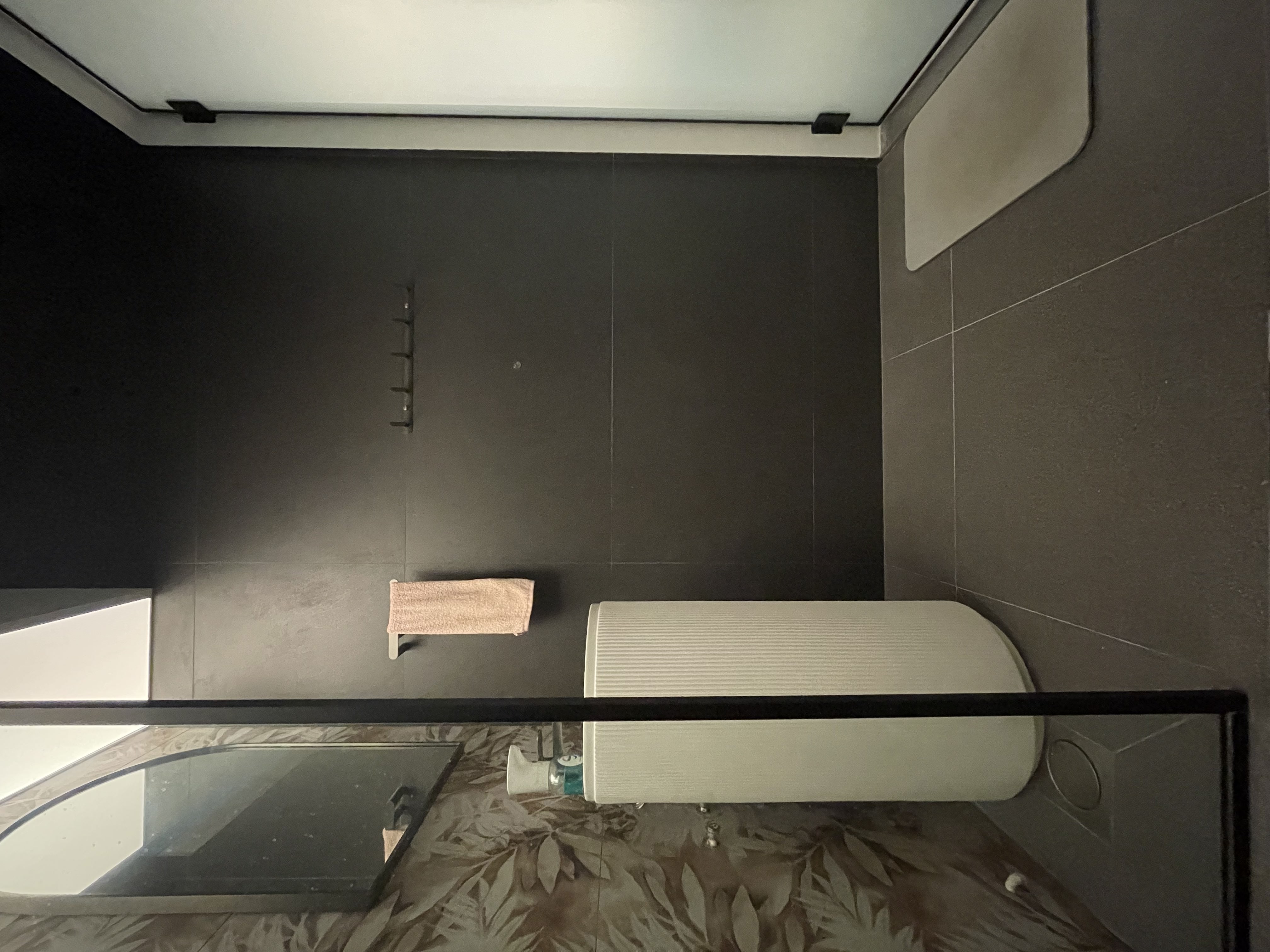 Our common toilet: The staycation villa restroom - modern bathroom, minimalist design, dark tiles, sleek fixtures, white