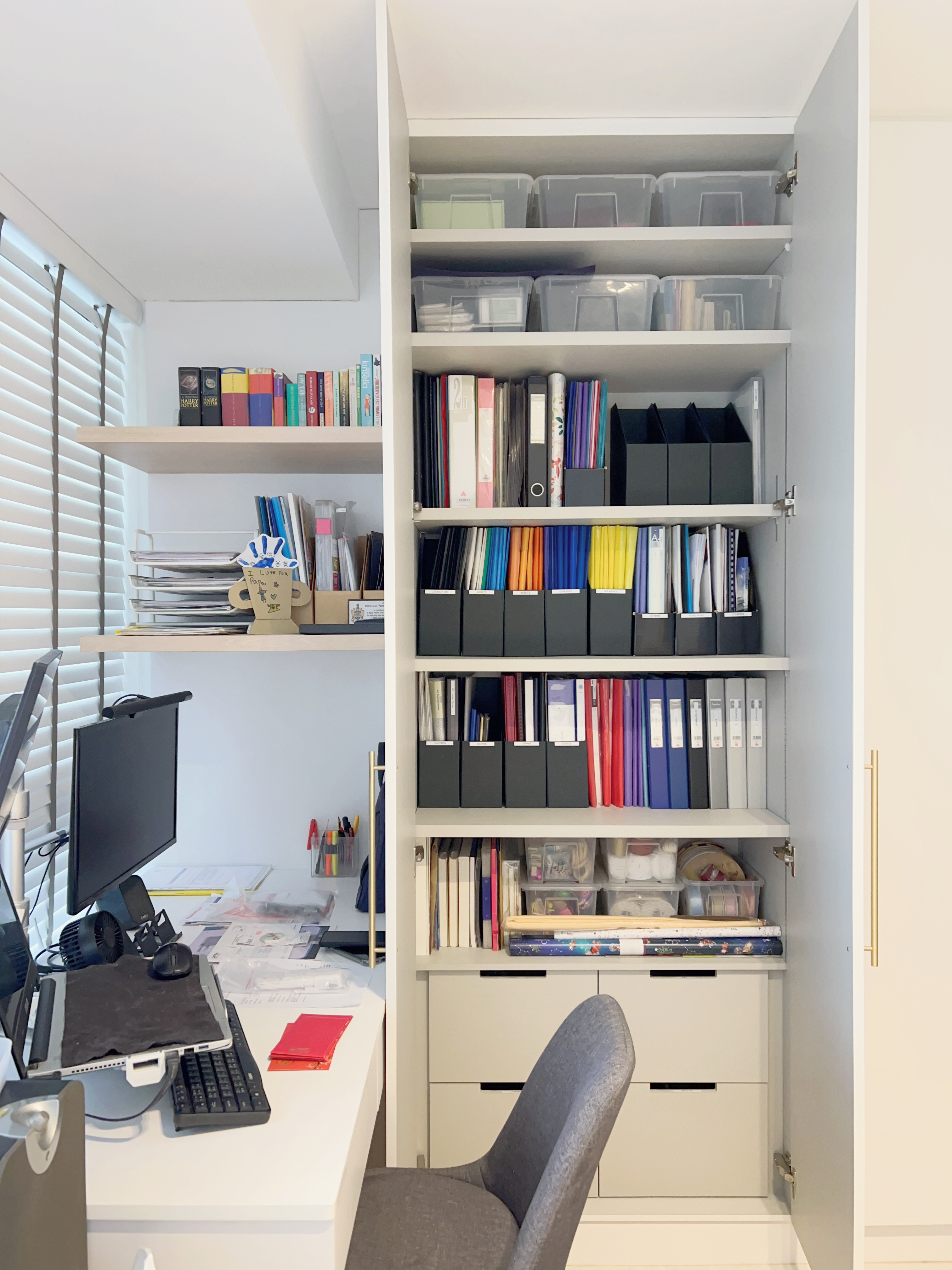 How to Design a Small but Functional Home Workspace - Organized workspace, desk setup, computer on stand, black monitor