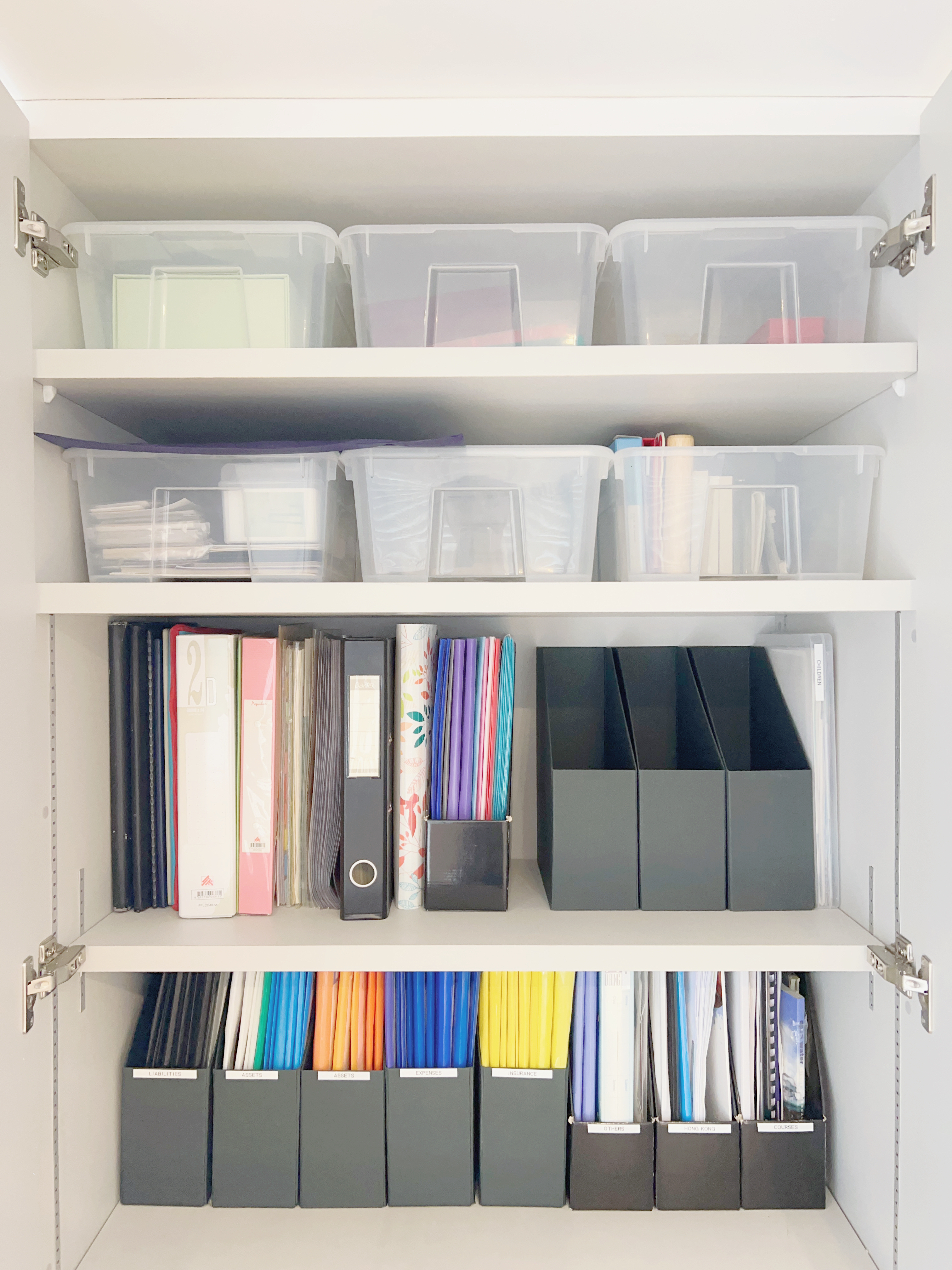 How to Design a Small but Functional Home Workspace - Organized storage solutions, neatly arranged folders, transparent