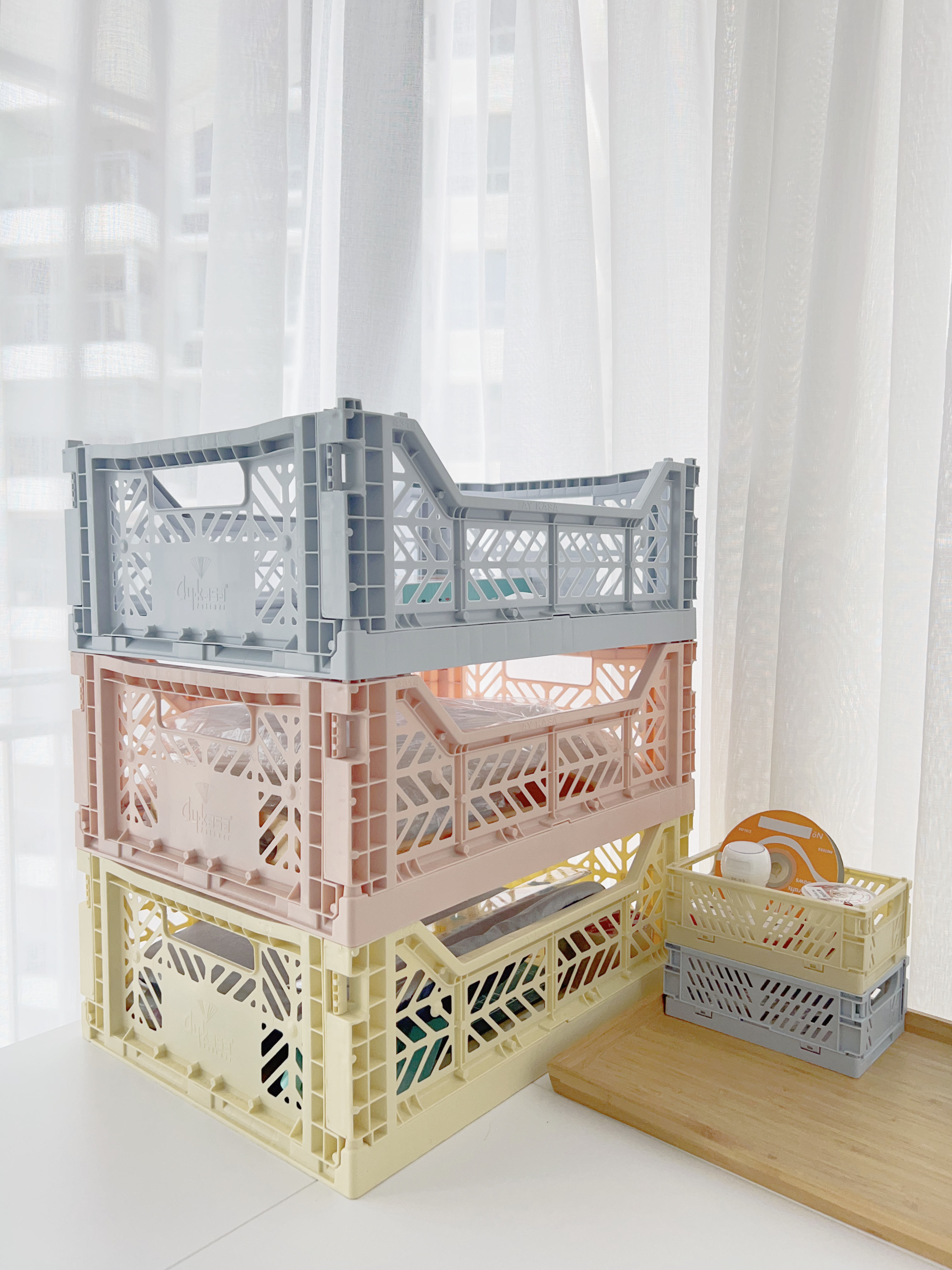 How to Design a Small but Functional Home Workspace - multi-colored plastic crates, stacked storage containers, modern