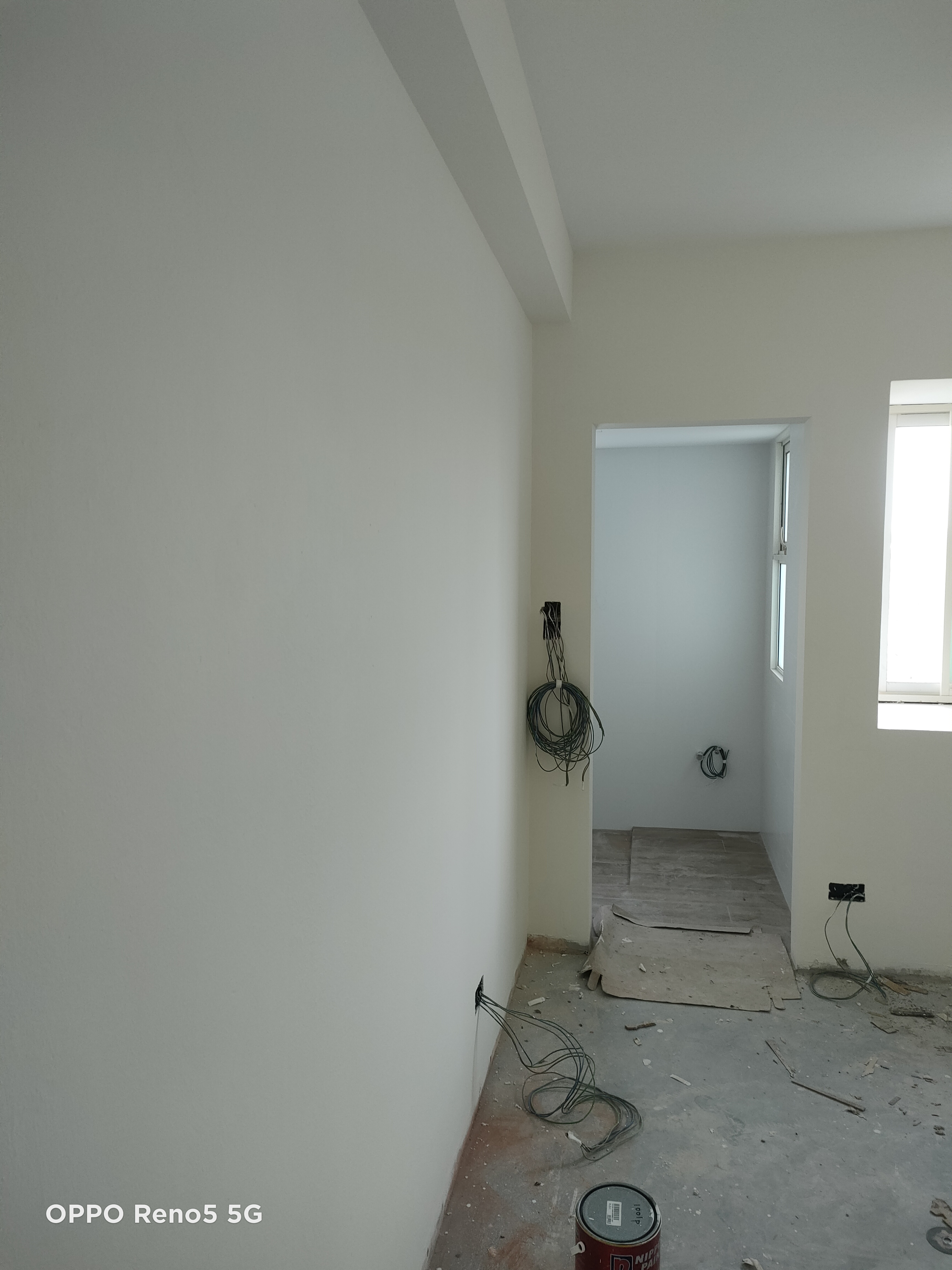 Each kid gets a bedroom!  - White-painted walls and unfinished floor, Electrical cords and exposed pipes, Empty room with