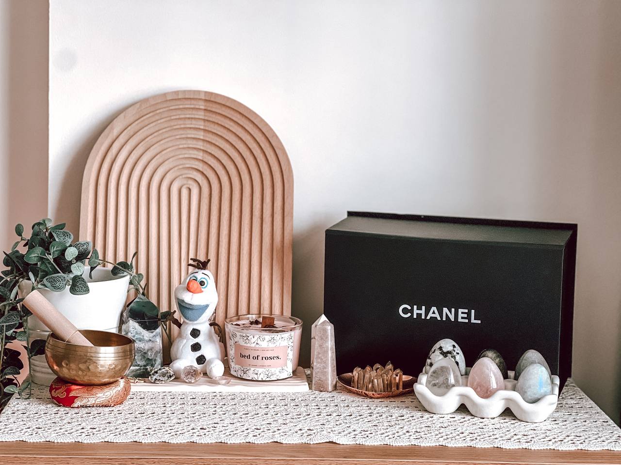 Our WFH office - Wooden medallion, snowman, candles, rose-themed box, jade stones, crystal bowl, potted plant, wooden board