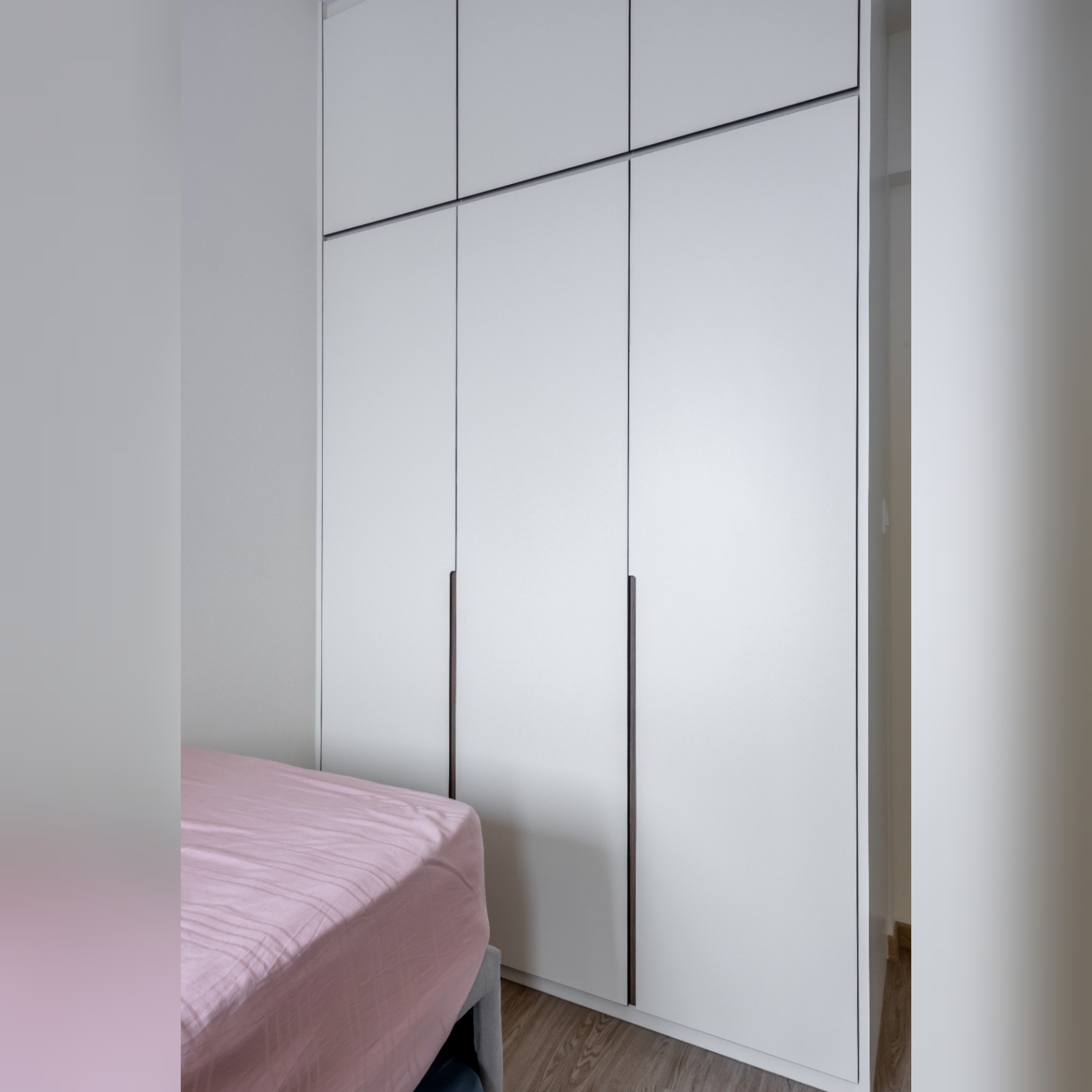 Each kid gets a bedroom!  - White wardrobe with black handles, minimalist design, modern aesthetic, sleek lines, clean lines