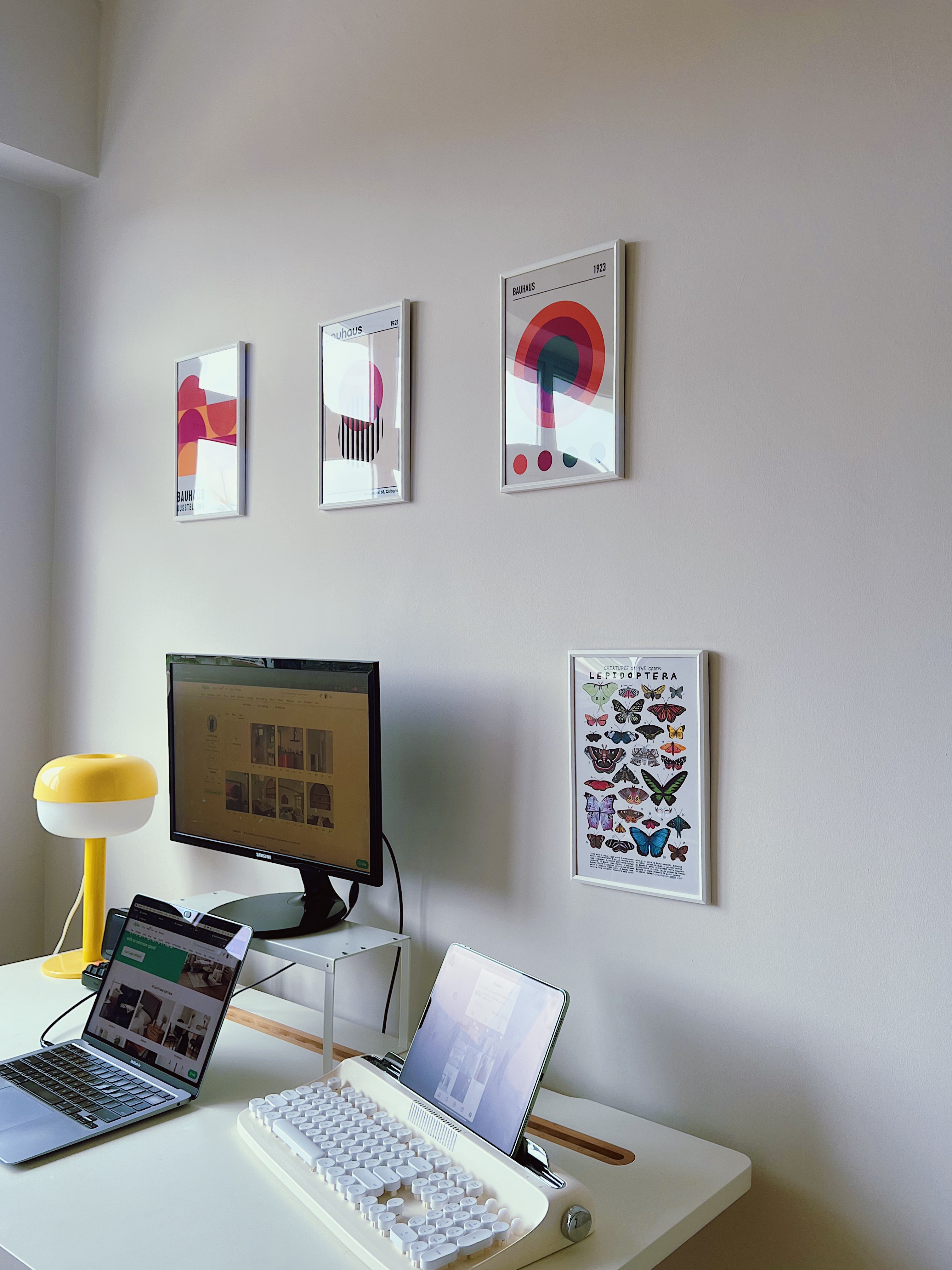Cubicle Who?: A WFH Space - Modern workspace, minimalist decor, sleek laptop, ergonomic desk, colorful abstract art, framed