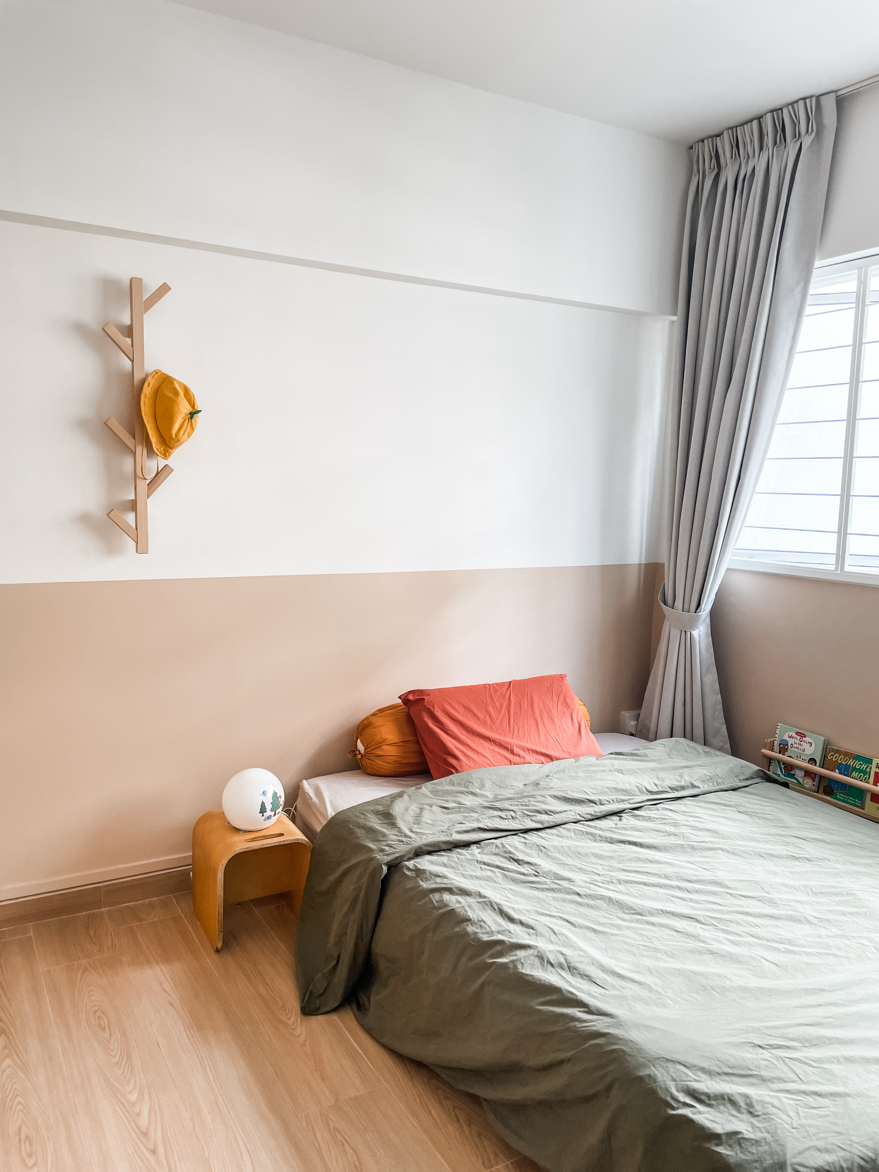 Kids' Rooms: Over The Rainbow And Into The Woodland - Wooden shelf with yellow hat, beige wall, wooden nightstand with white