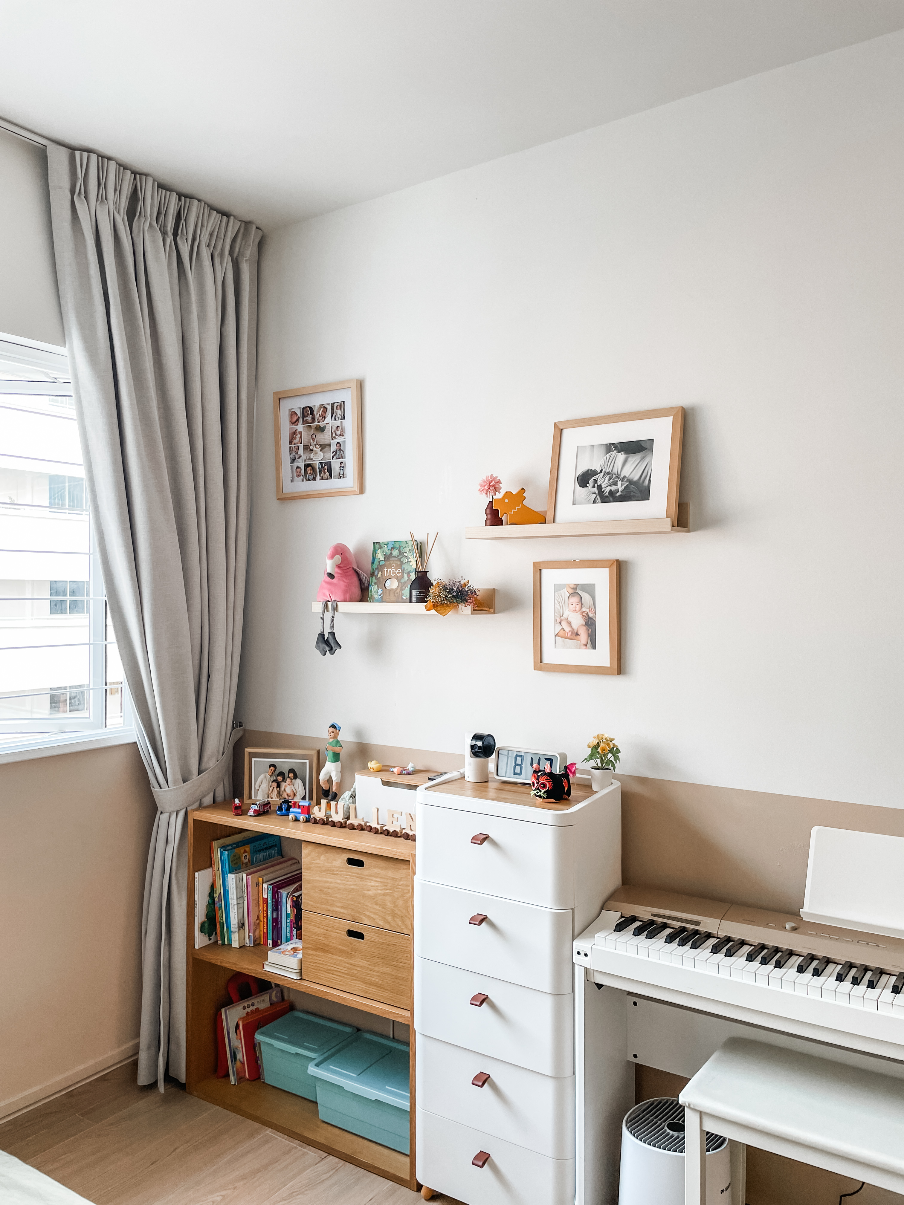 Kids' Rooms: Over The Rainbow And Into The Woodland - Light fixture, white piano, wooden bookshelf, gray curtains, framed