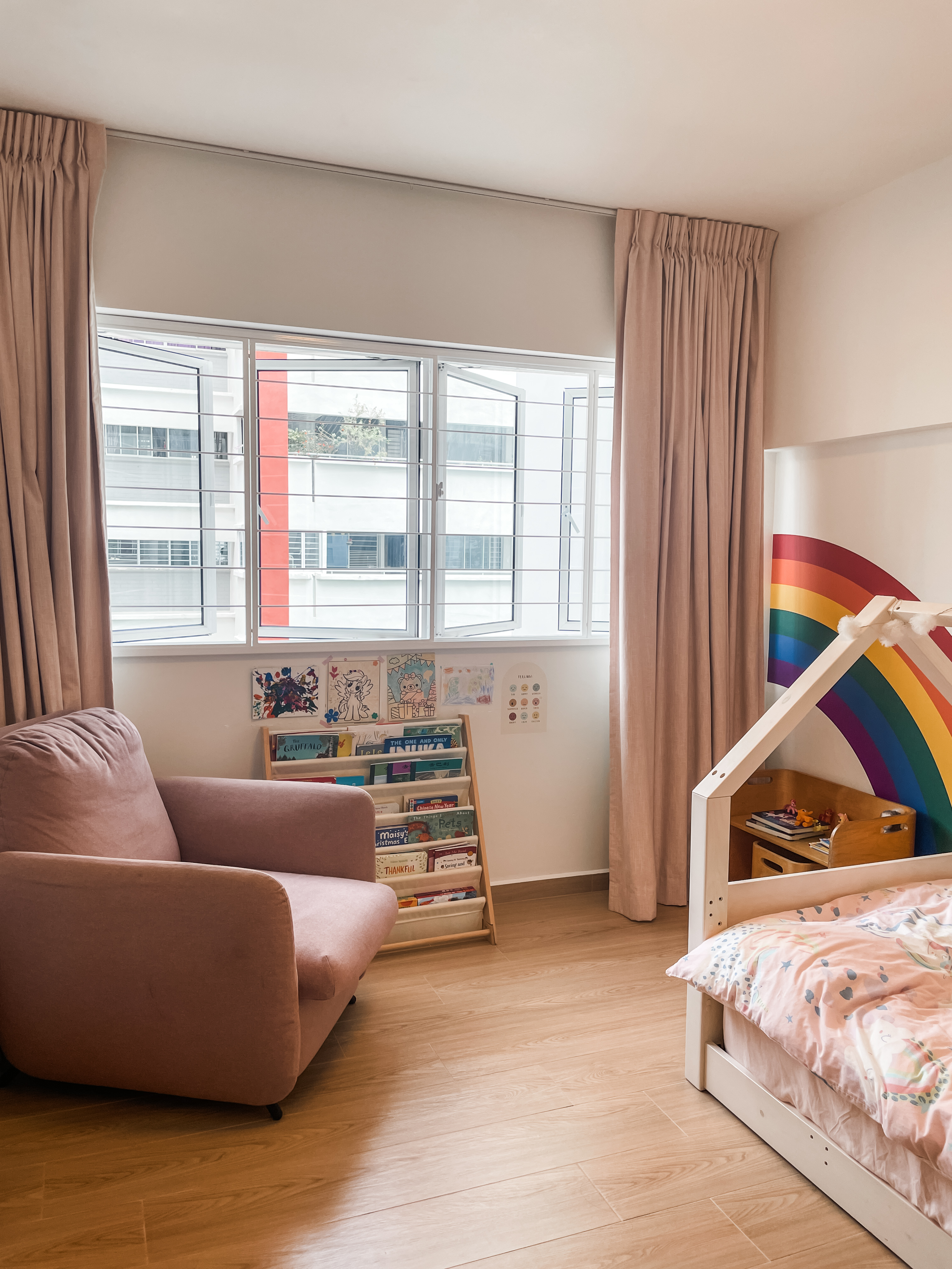 Kids' Rooms: Over The Rainbow And Into The Woodland - Soft, cozy living room with beige curtains, wooden floor, pink