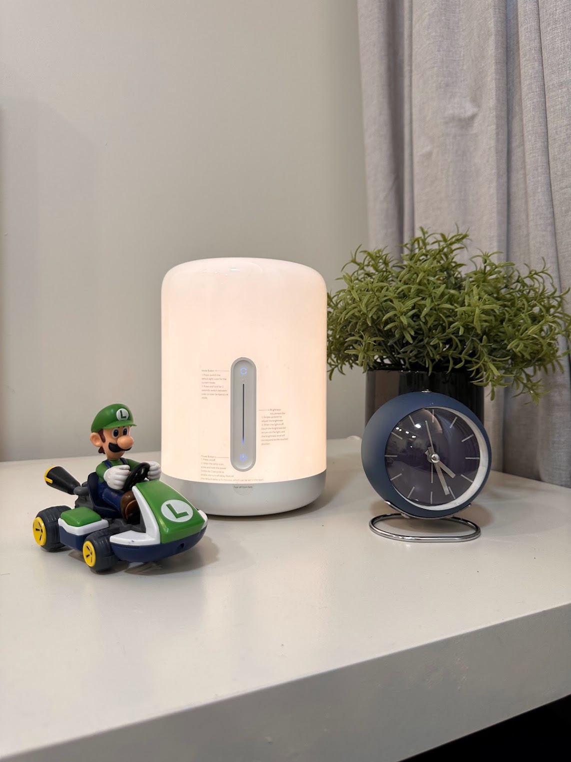 A Super Mario wonderland  - smart home device, eco-friendly air purifier, toy car, green plant, minimalist decor, modern