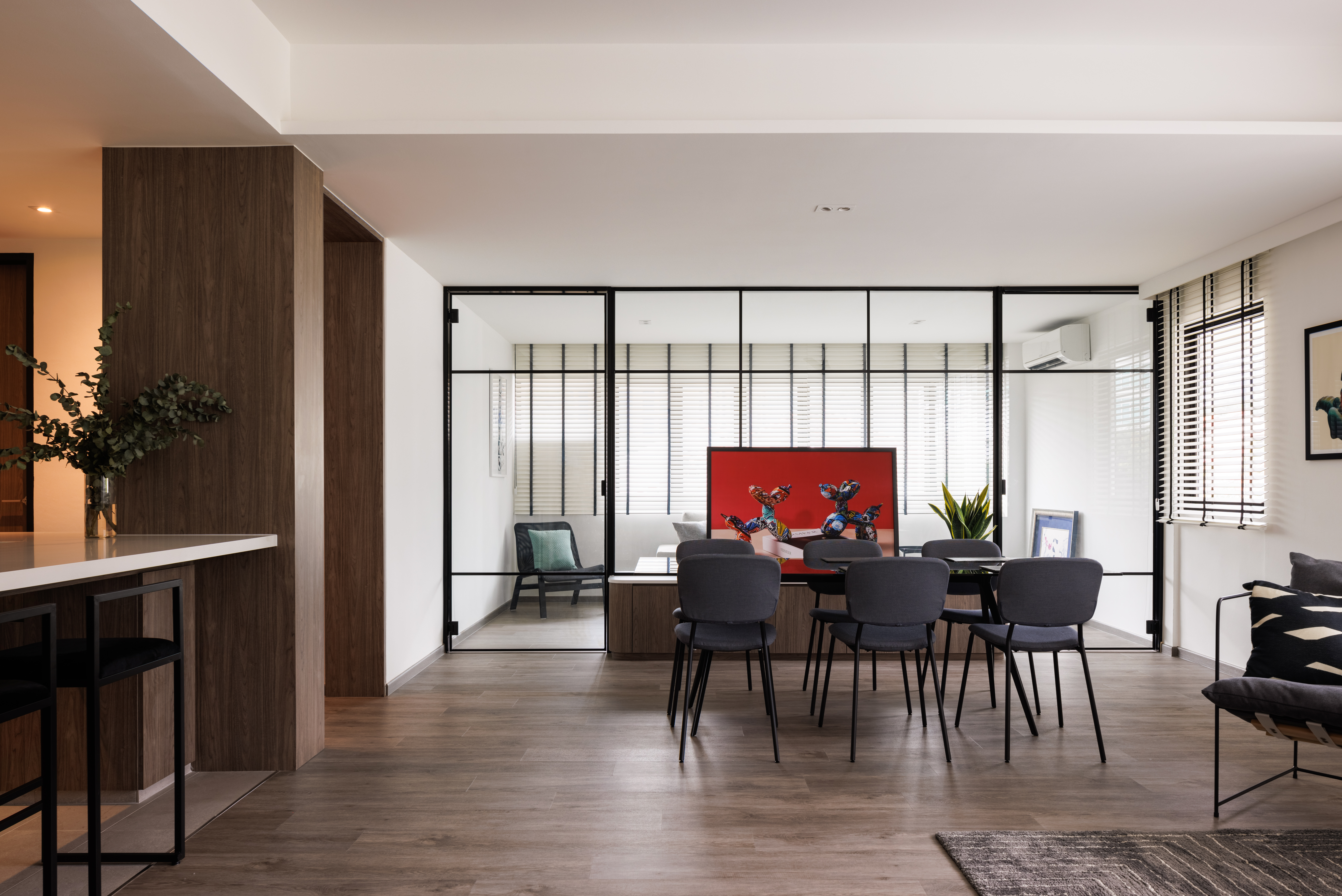 A Bright and Elegant Open Plan Home - Modern dining room with sleek furniture, wooden accents, contemporary decor, large