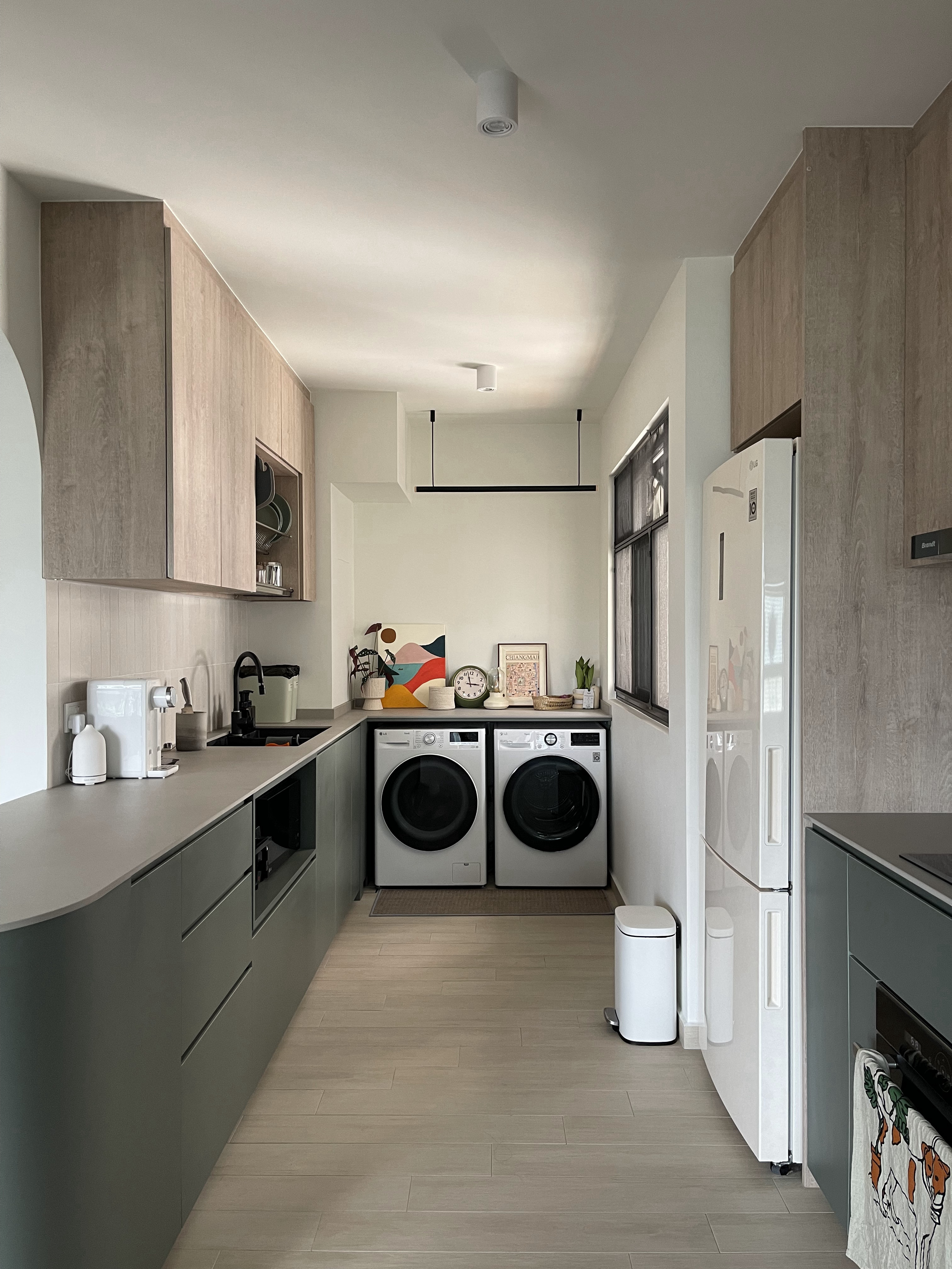 An Open-concept Galley Kitchen + Service Yard - modern kitchen, minimalist design, sleek cabinetry, light wood finish, gray