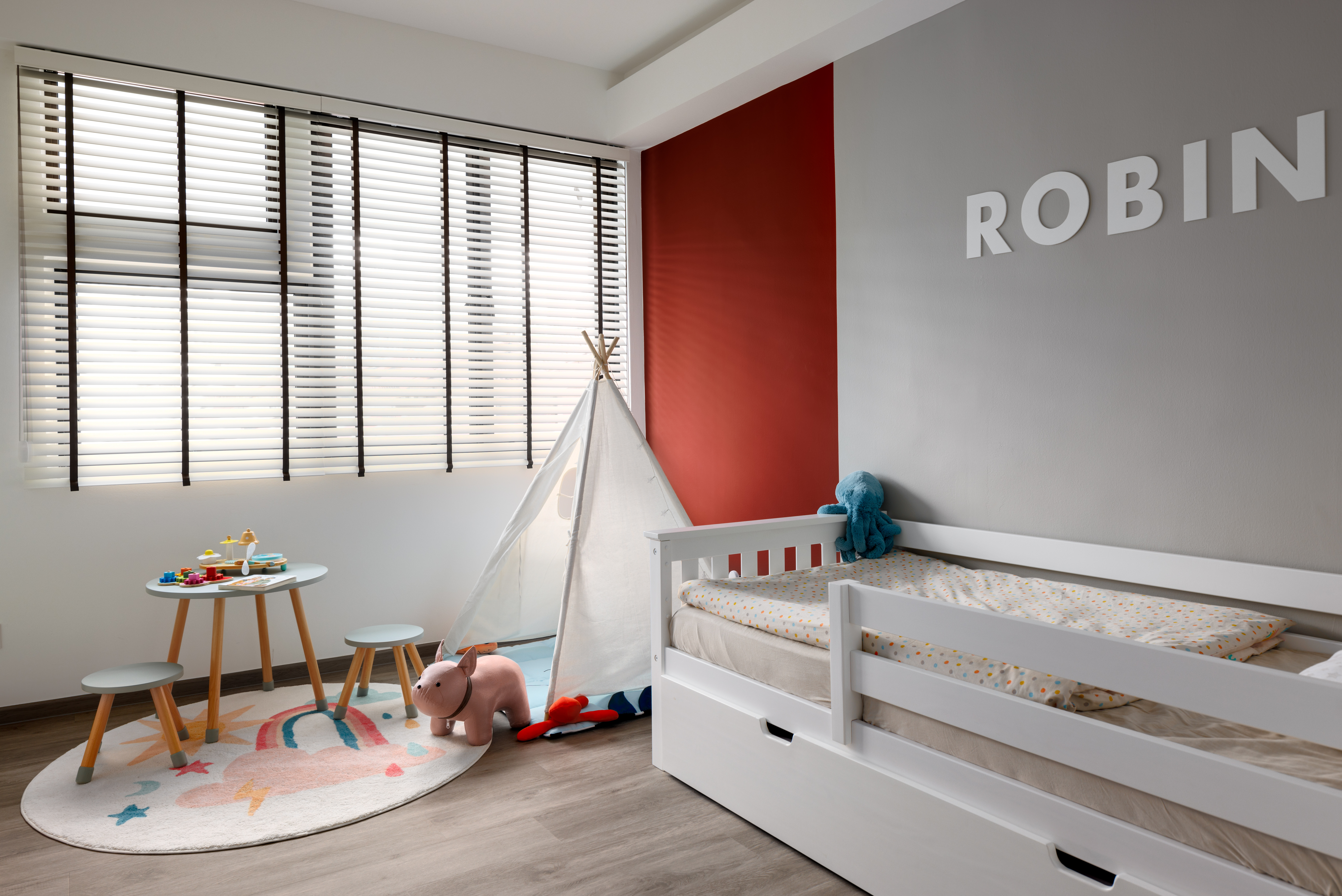 A Bright and Elegant Open Plan Home - Children's playroom, toddler play area, colorful rug, white tent, wooden stools, soft