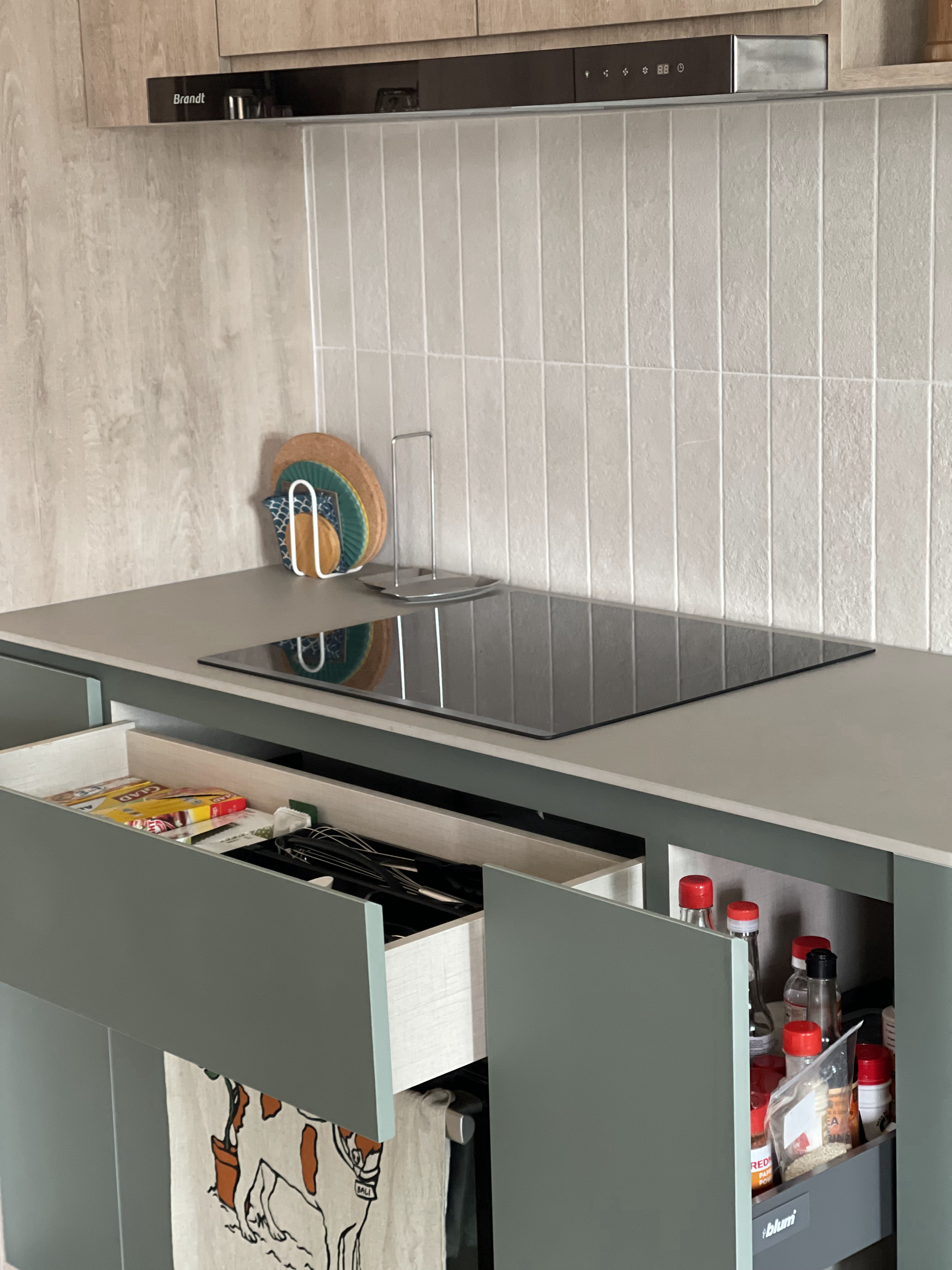 An Open-concept Galley Kitchen + Service Yard - Kitchen countertop, modern cabinets, stainless steel range hood, light wood