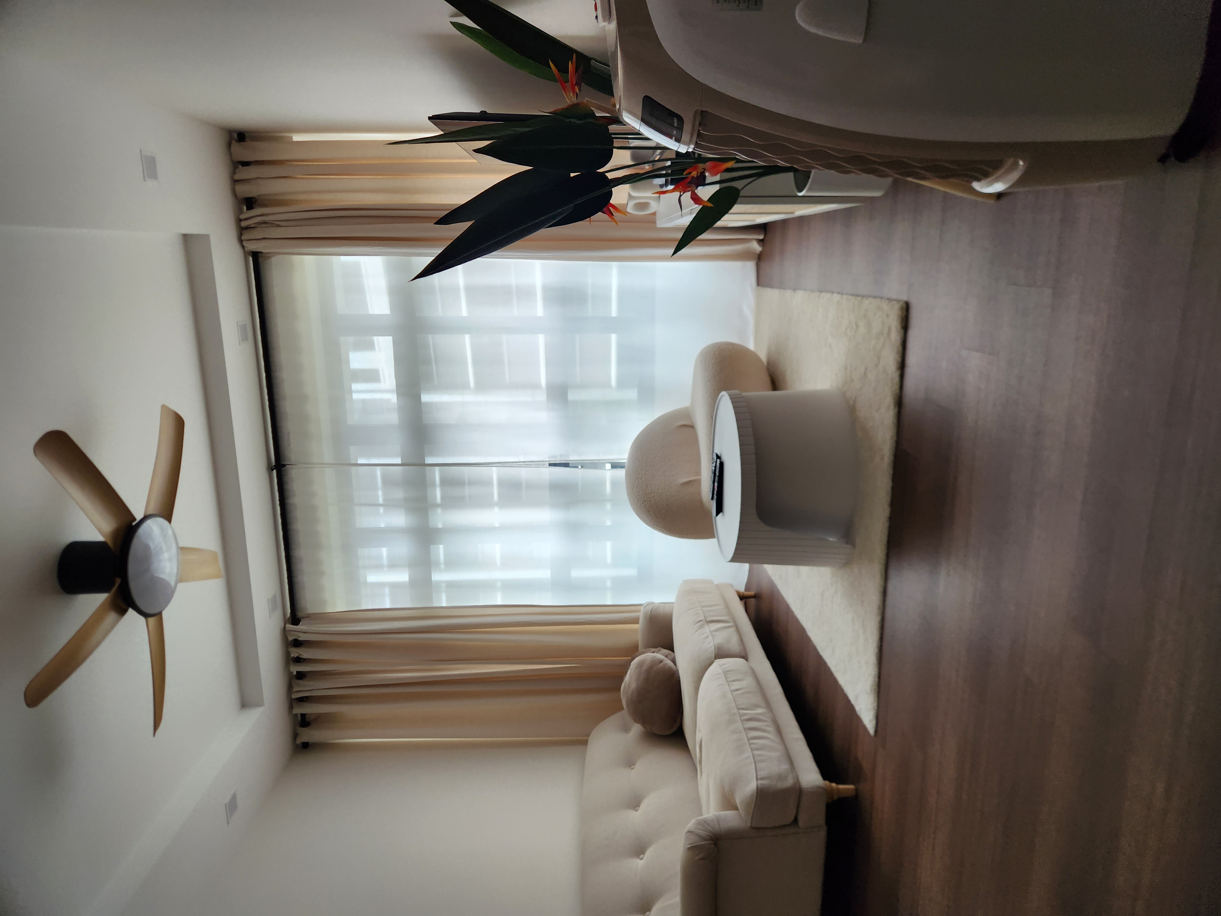 A modern and minimalist living room with scandinavian charm - Modern living room, cozy atmosphere, beige sofa, plush