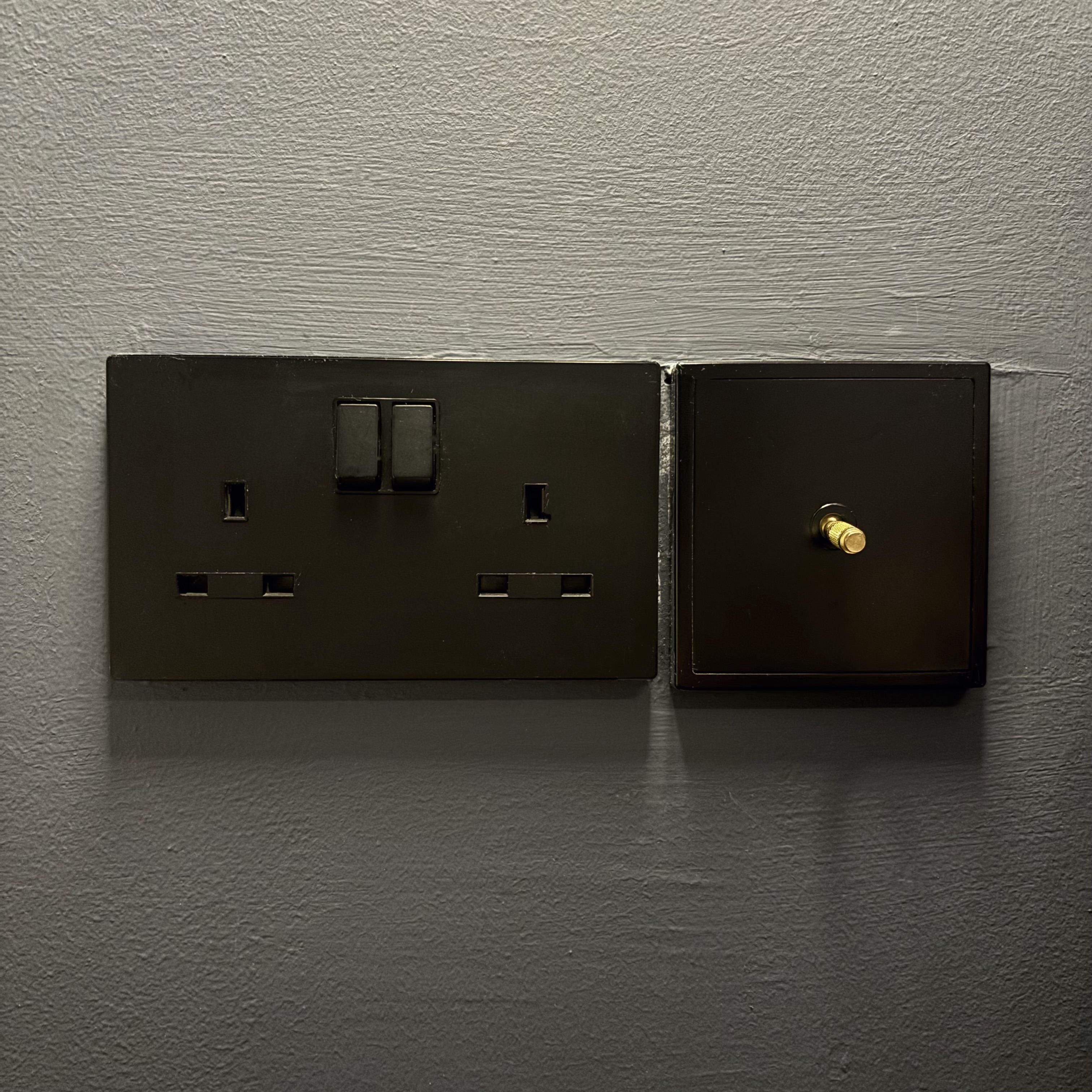 Embrace the dark theme cozy bedroom vibes 🌃 - Wall-mounted electrical outlet, black metal box, dual outlets, switch