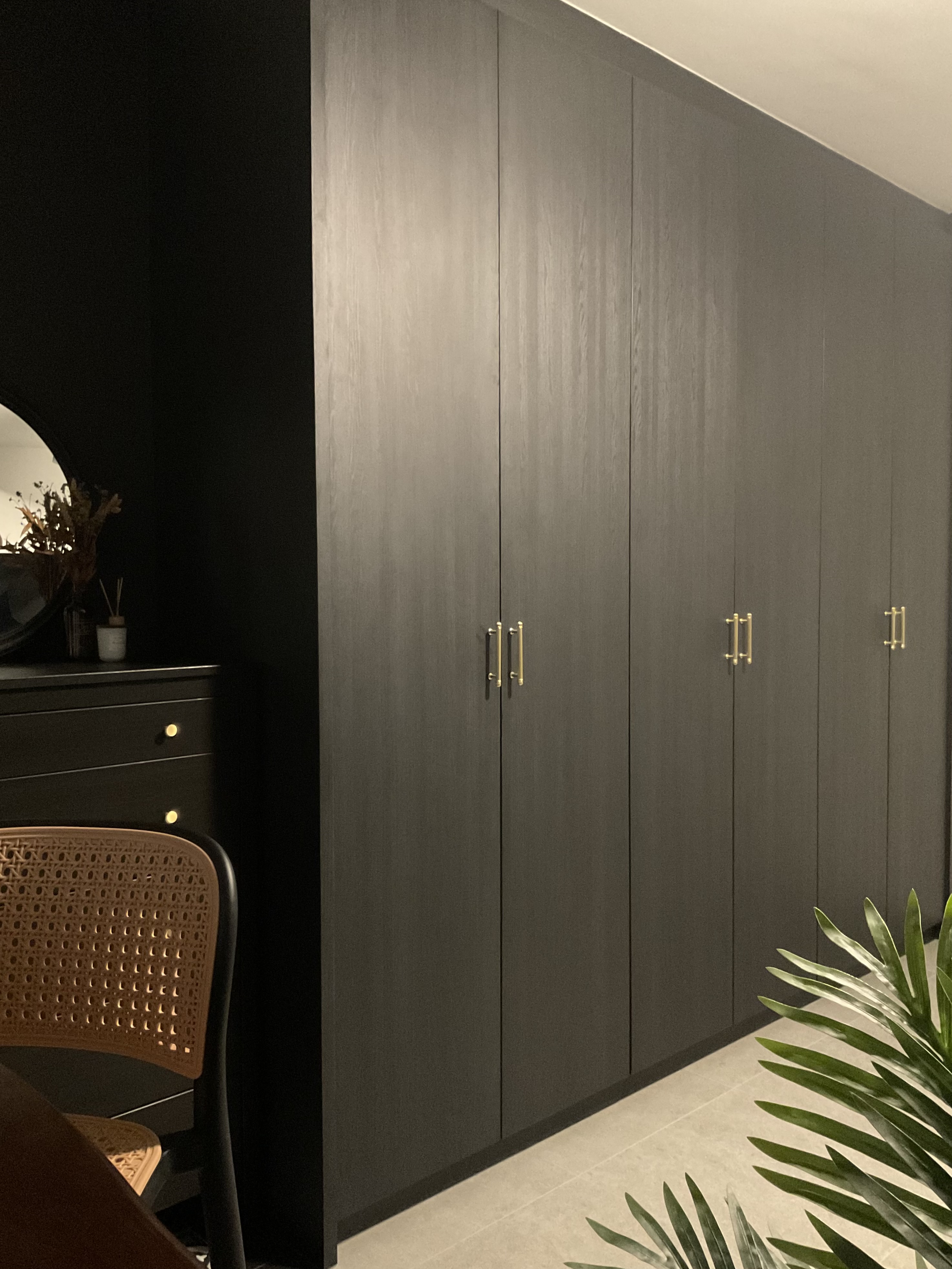 Embrace the dark theme cozy bedroom vibes 🌃 - Dark gray wooden wardrobe, gold handles, minimalist design, sleek lines