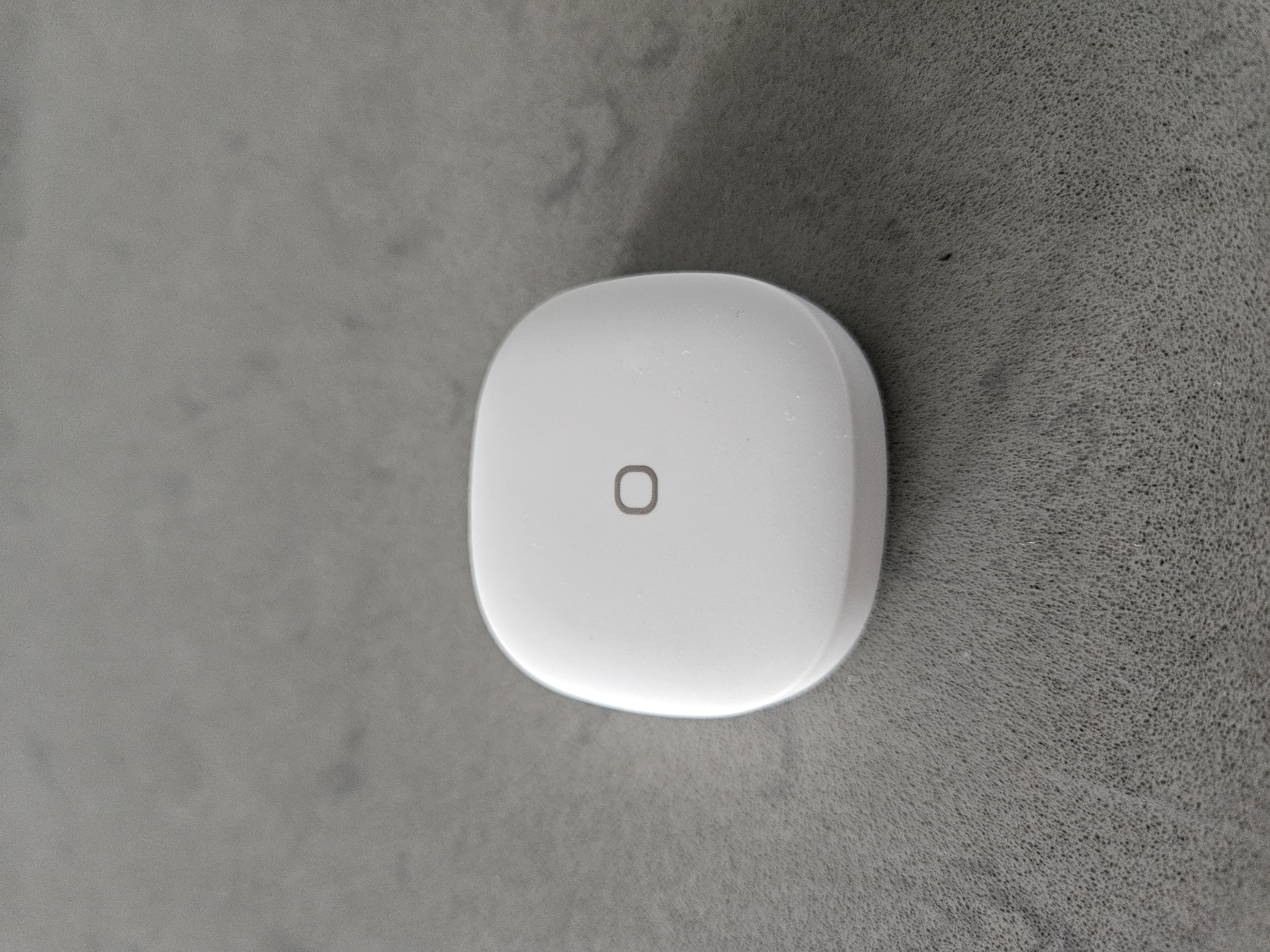 Integrating Smart Devices In Our Home - Sleek, modern wireless charging pad, Minimalist wireless charging device, White