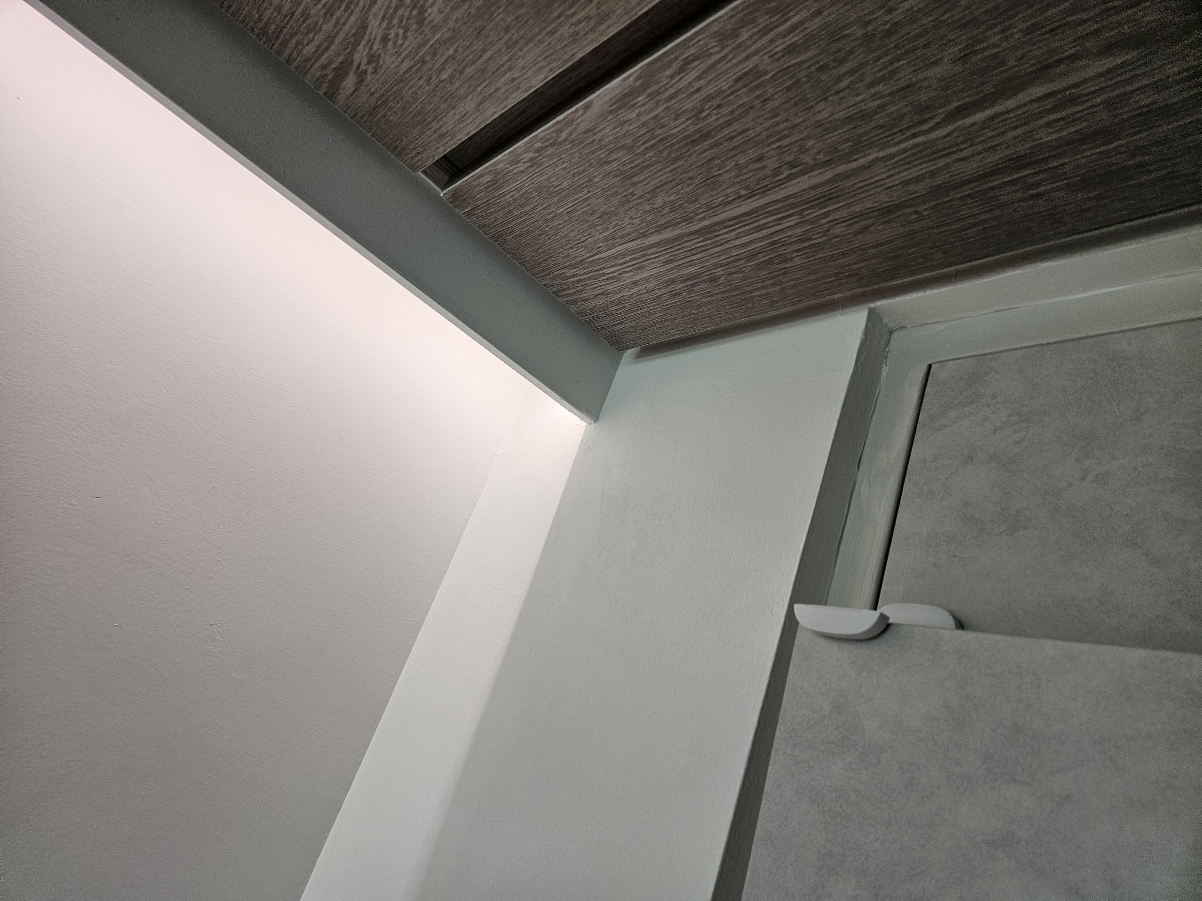 Integrating Smart Devices In Our Home - Sleek, modern cabinetry with dark wood finish, Minimalist design with white and gray